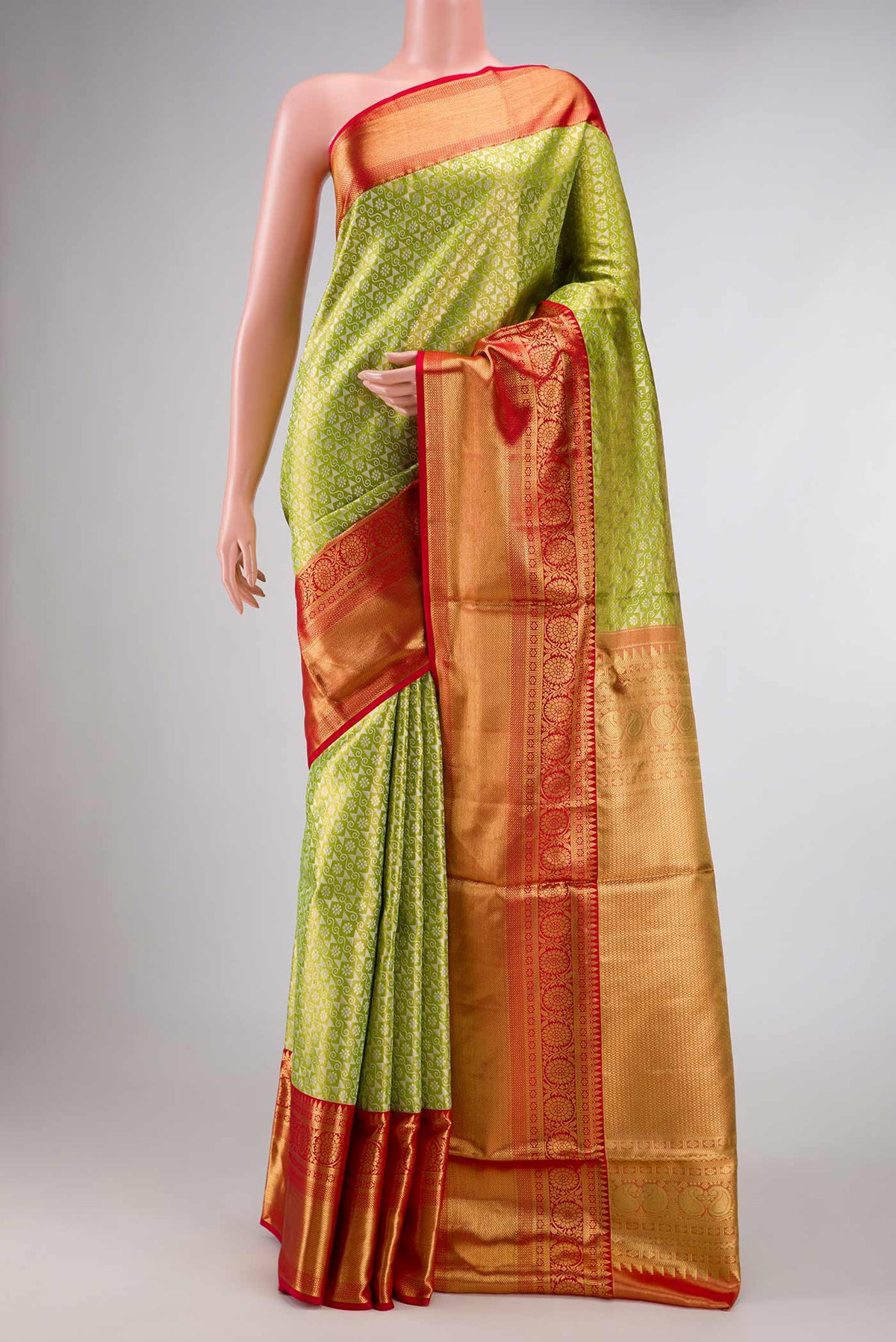 Green Dual Tone Kanchipuram Tissue Silk Saree with Zari Brocade on the body and Zari Border displayed on a mannequin