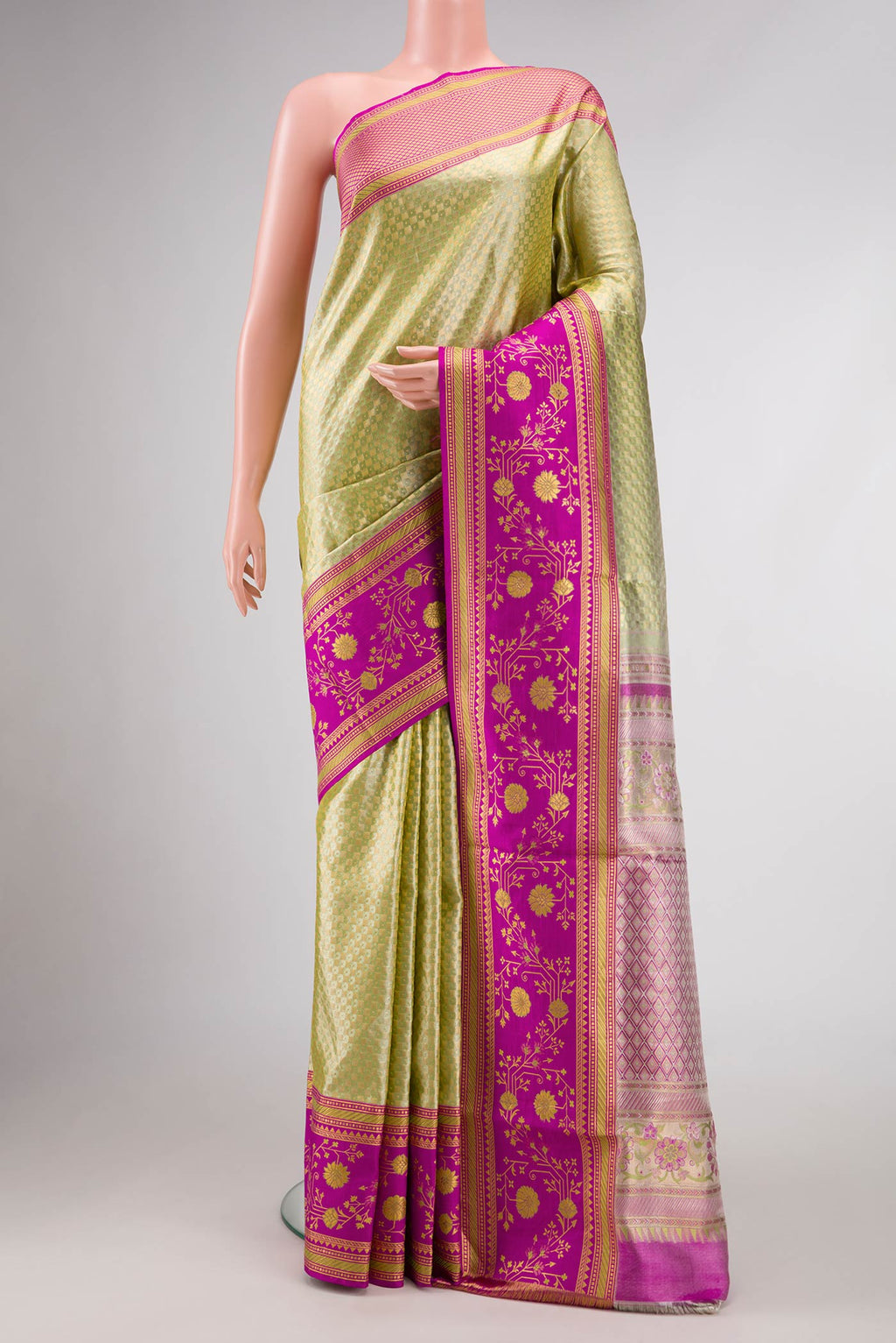 Light Green Dual Tone Kanchipuram Tissue Silk Saree with Zari Brocade on the body and Fancy Border.  displayed on a mannequin