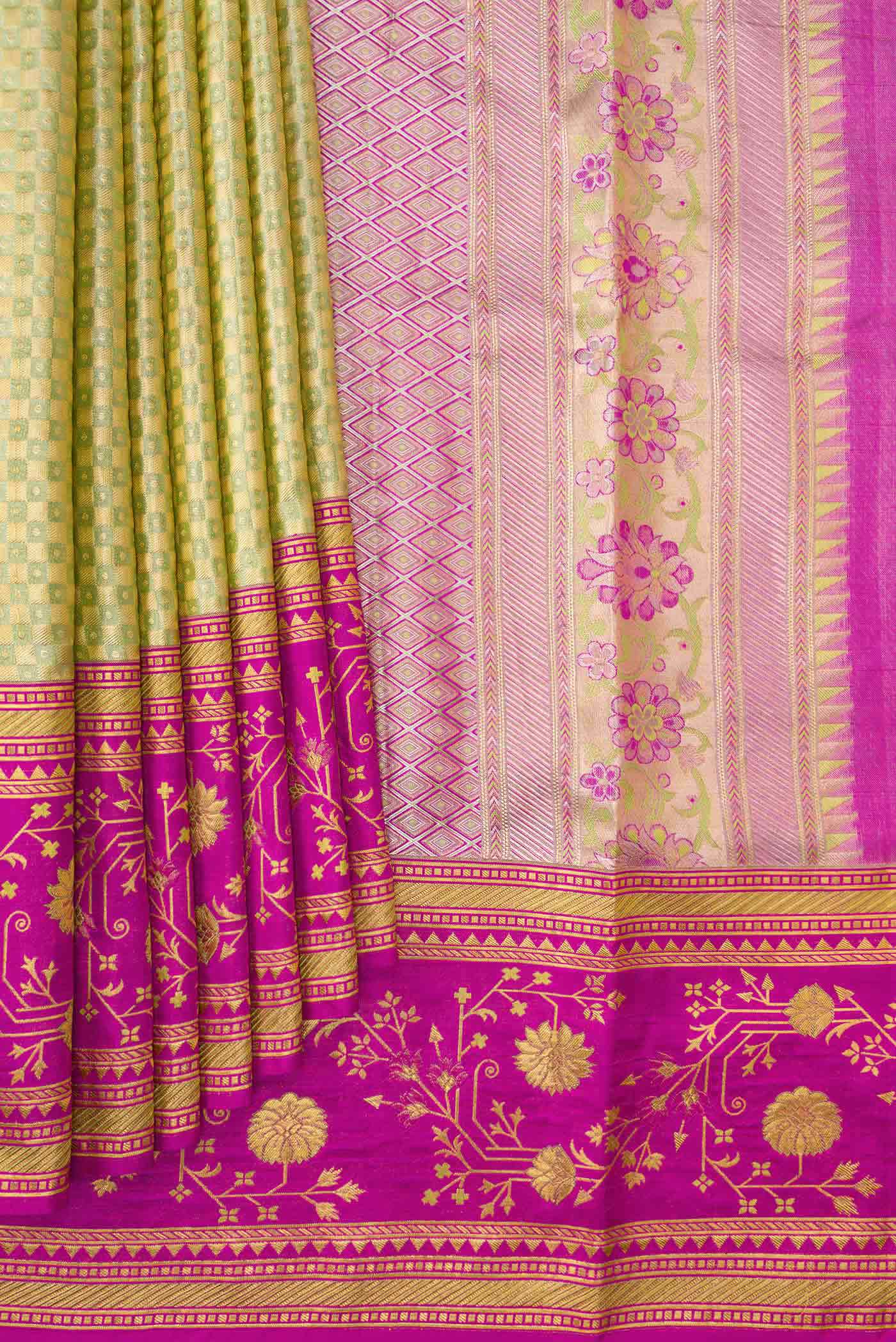 Pleats and pallu of Light Green Dual Tone Kanchipuram Tissue Silk Saree with Zari Brocade on the body and Fancy Border. 