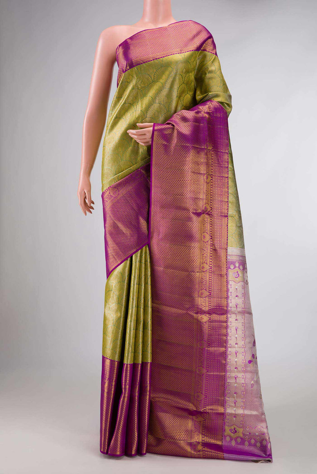 Green Dual Tone Kanchipuram Tissue Silk Saree with Zari Brocade on the body and Zari Border displayed on a mannequin