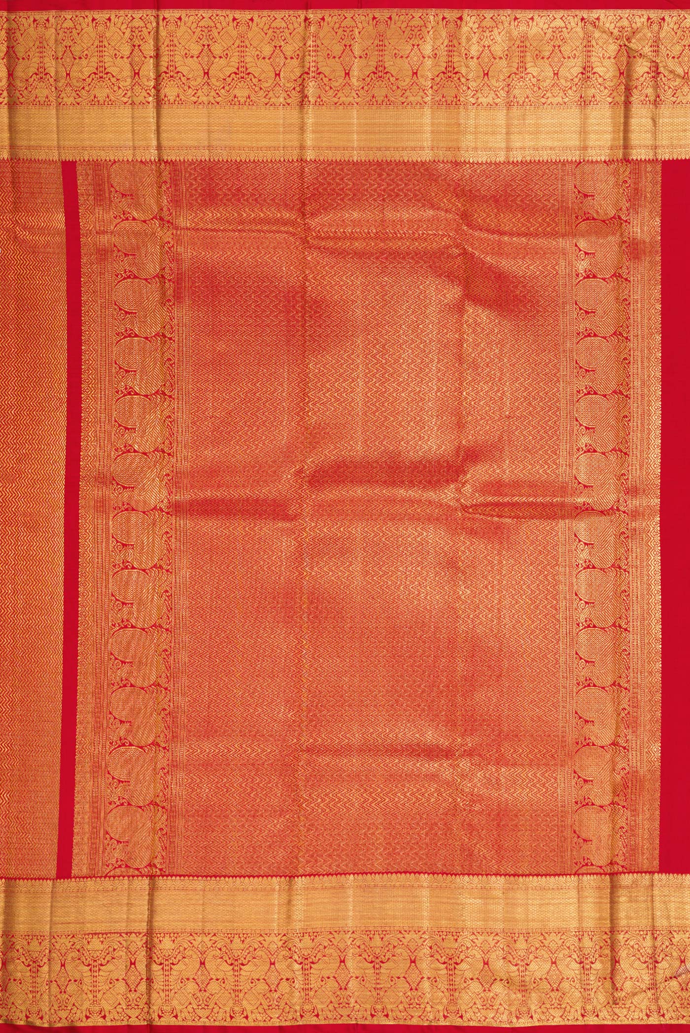 Close up image of the pallu of Red Dual Tone Kanchipuram Silk Saree with Zari Brocade on the body and Zari Border. 