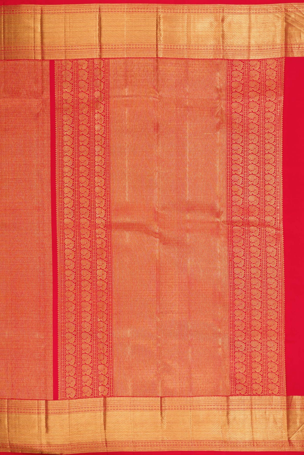Close up image of the pallu of Red Kanchipuram Silk Saree with Zari Brocade on the body and Zari Border. 