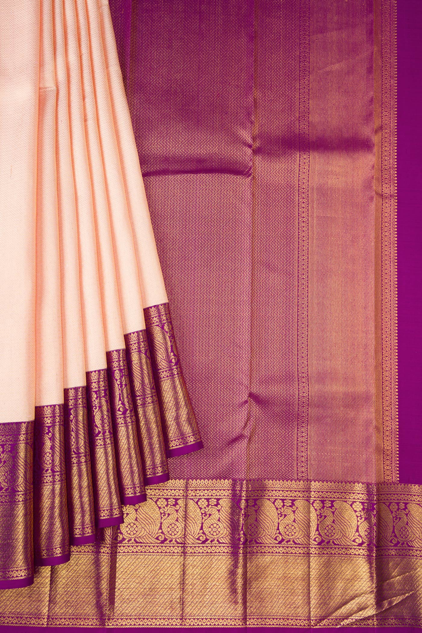 Pleats and pallu of Golden Peach Dual Tone Kanchipuram Silk Saree with Zari Brocade on the body and Zari Border. 