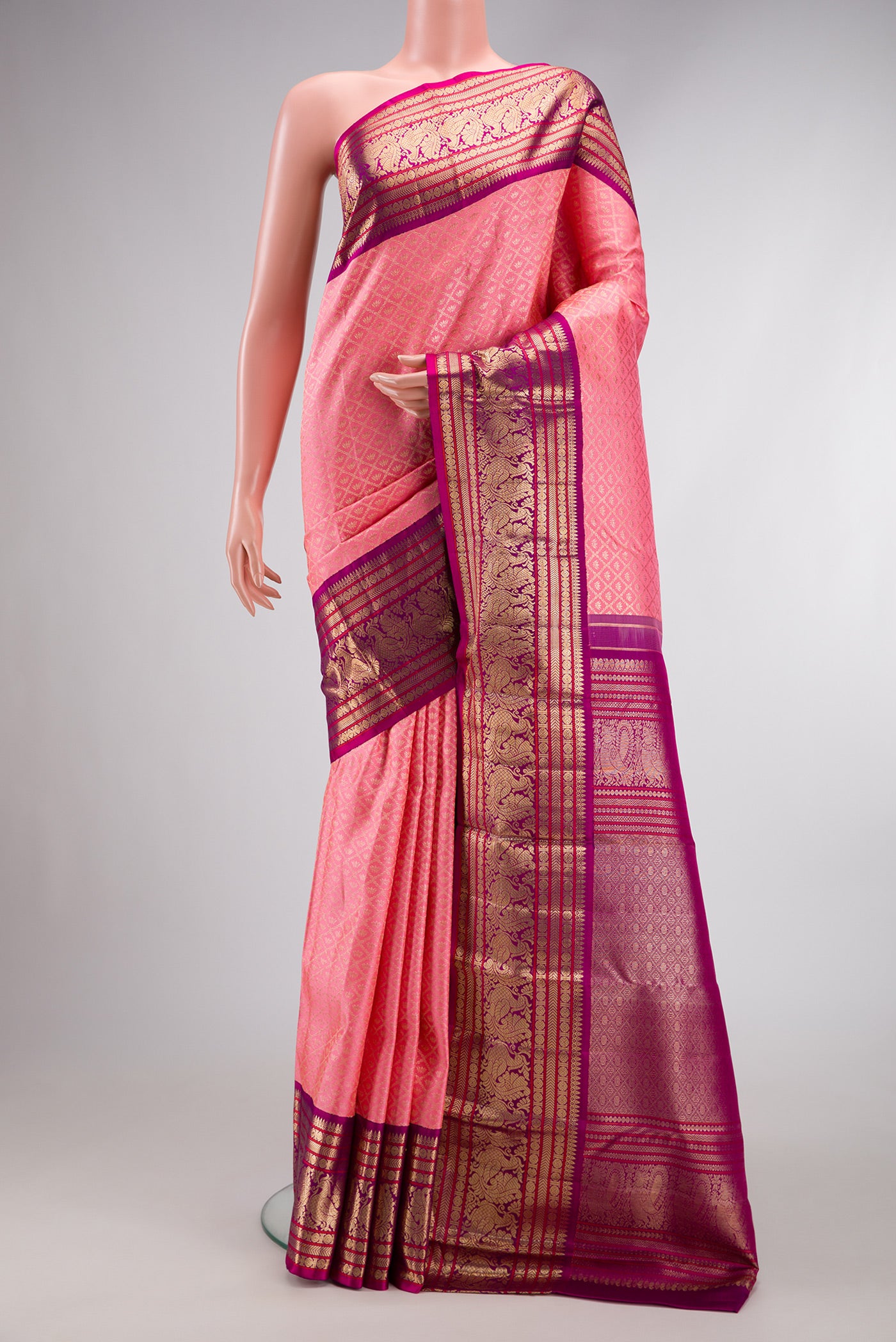 Pink Dual Tone Kanchipuram Silk Saree with Zari Brocade on the body and Zari Border.  displayed on a mannequin