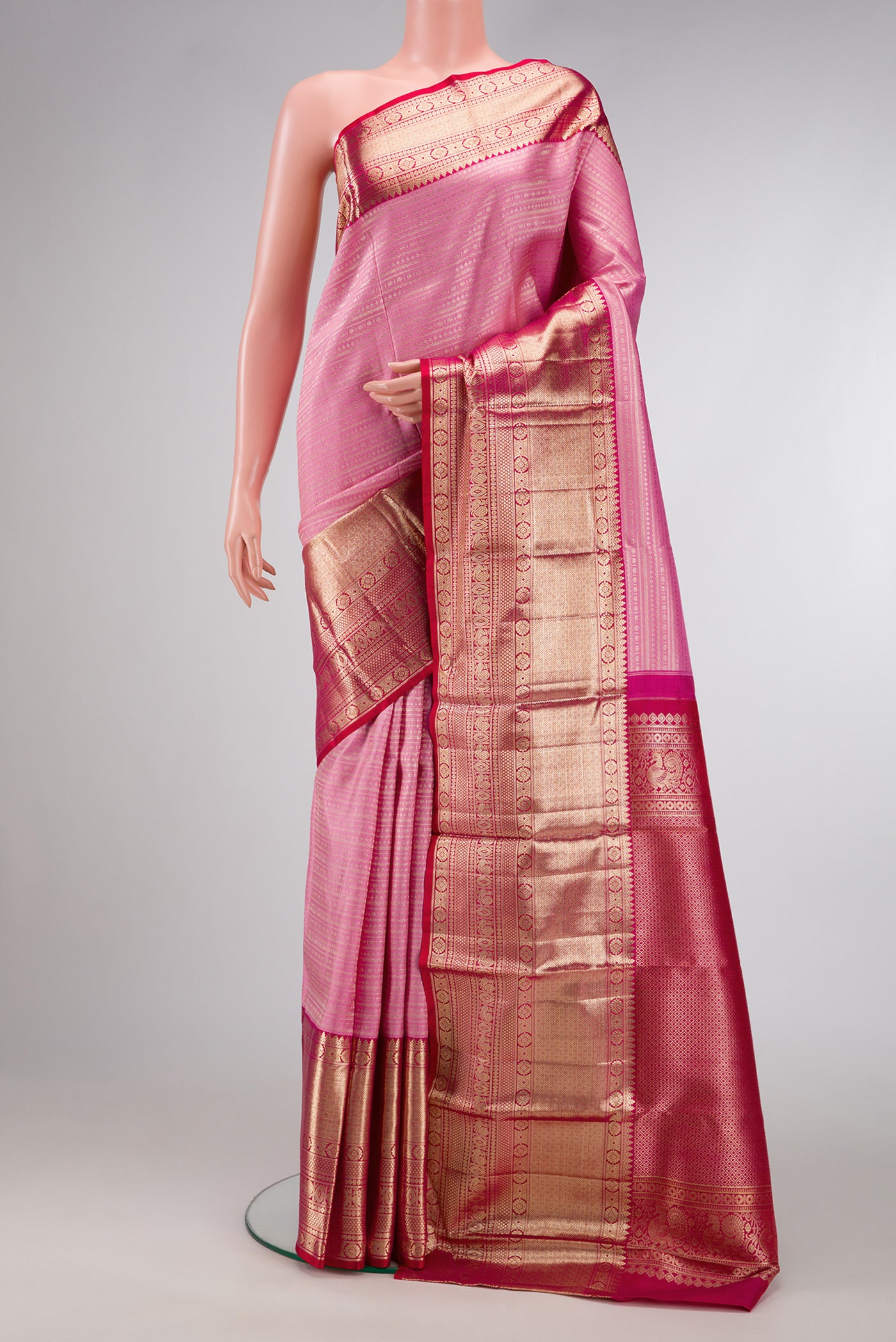 Pink Dual Tone Kanchipuram Silk Saree with Zari Brocade on the body and Zari Border.  displayed on a mannequin