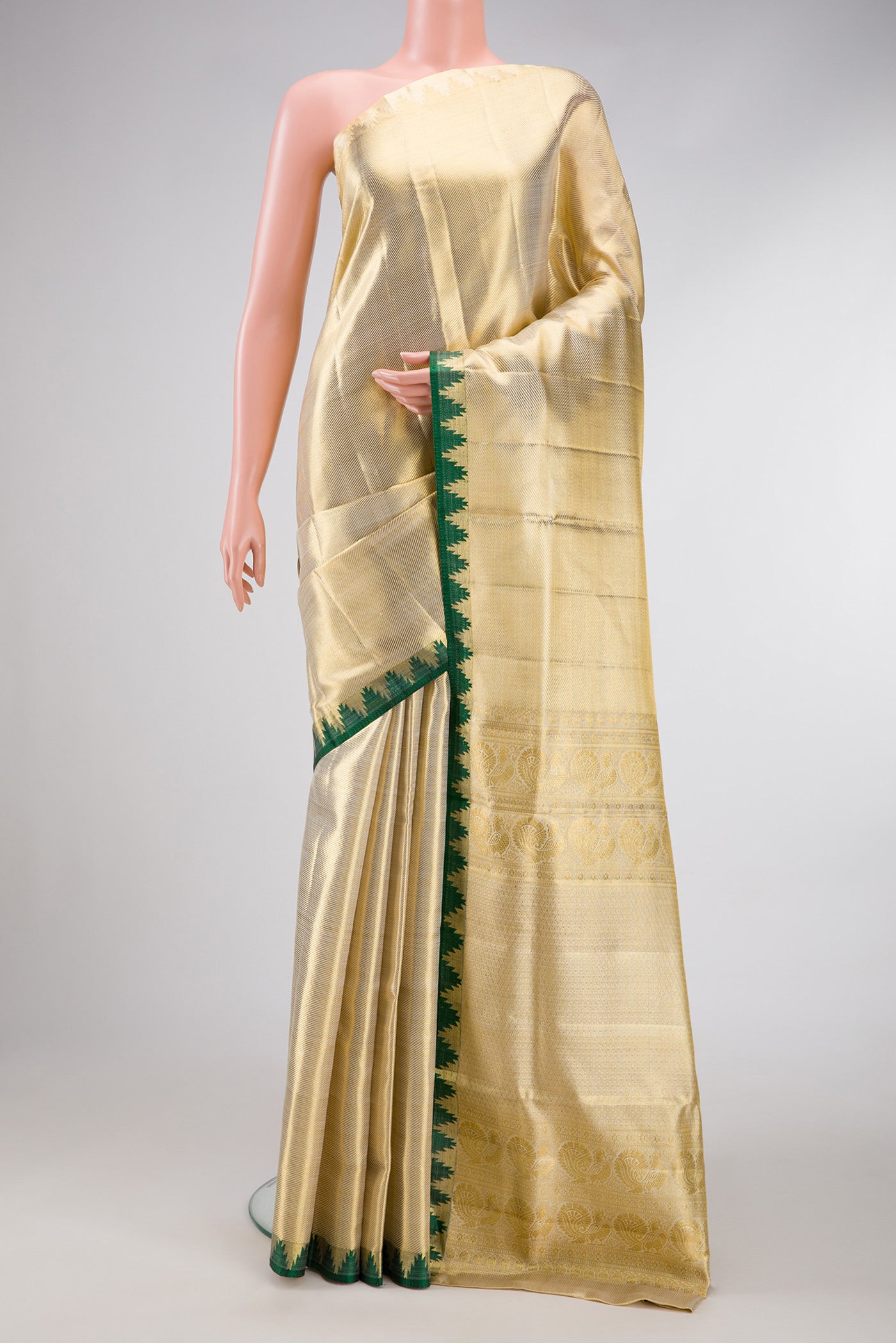 Gold Dual Tone Kanjivaram Tissue Silk Saree with Zari Brocade on the body and Temple Border.  displayed on a mannequin