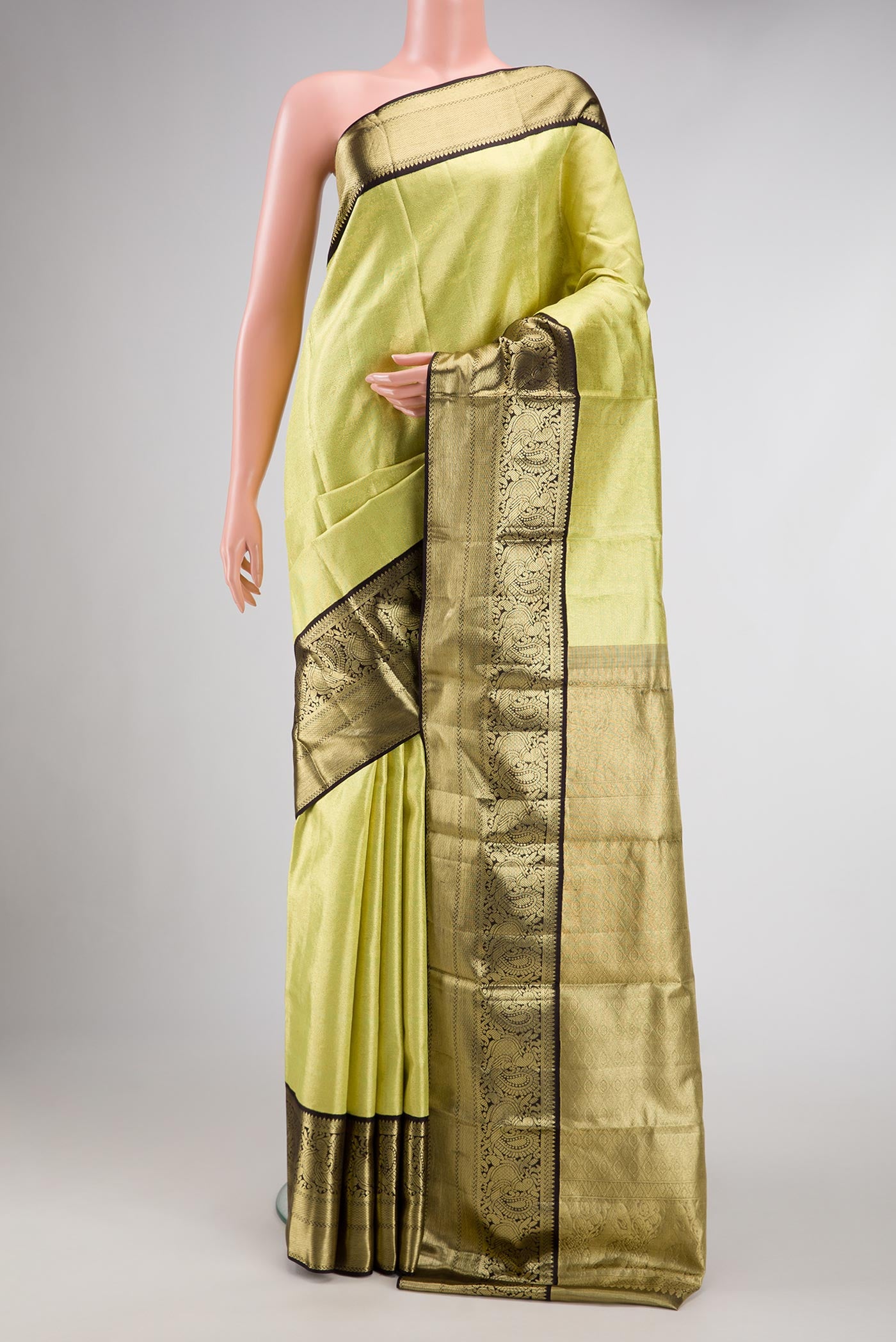 Pista Green Dual Tone Kanjivaram Tissue Silk Saree with Zari Brocade on the body and Zari Border.  displayed on a mannequin