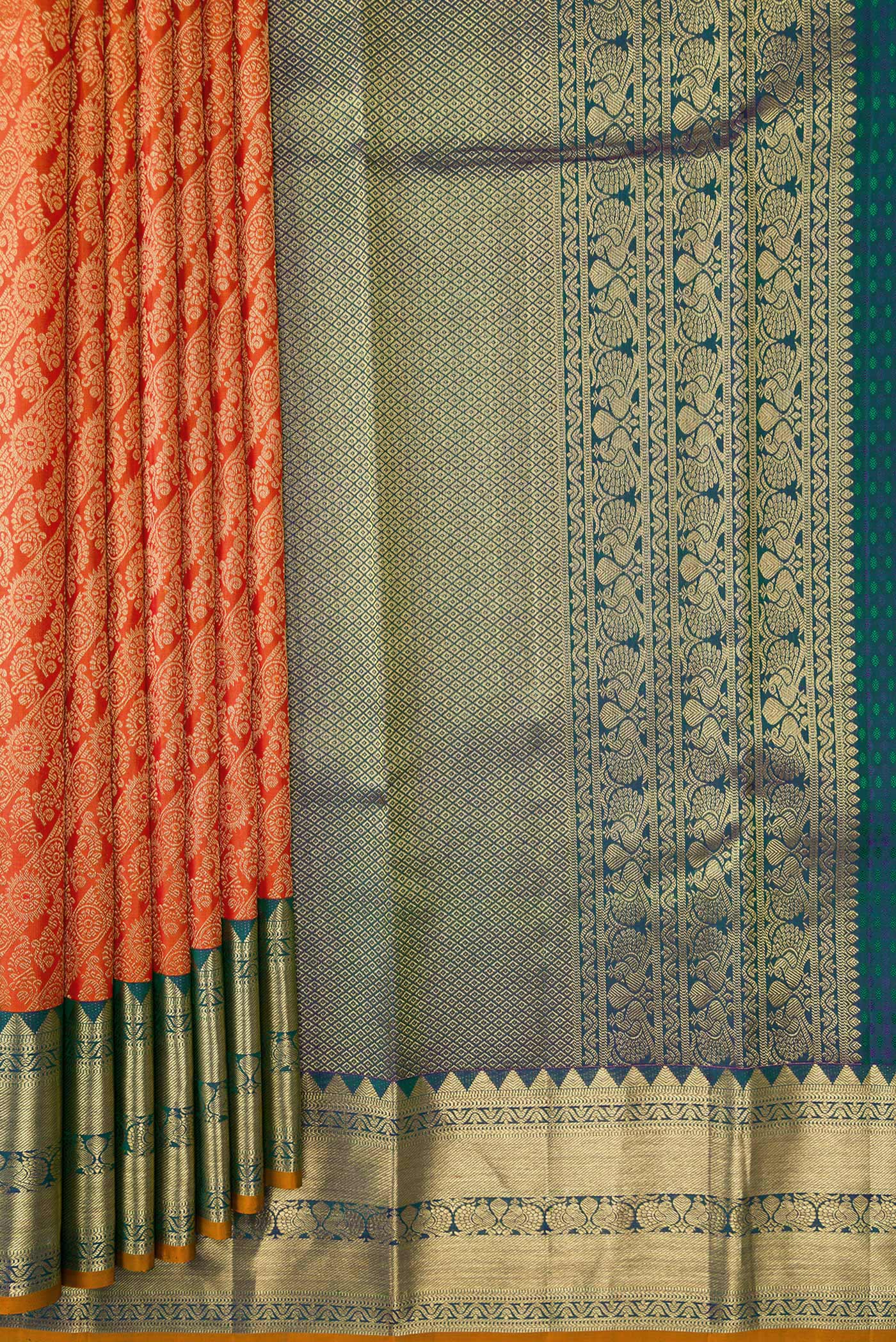 Pleats and pallu of Orange Dual Tone Kanjivaram Silk Saree with Zari Brocade on the body and Zari Border. 