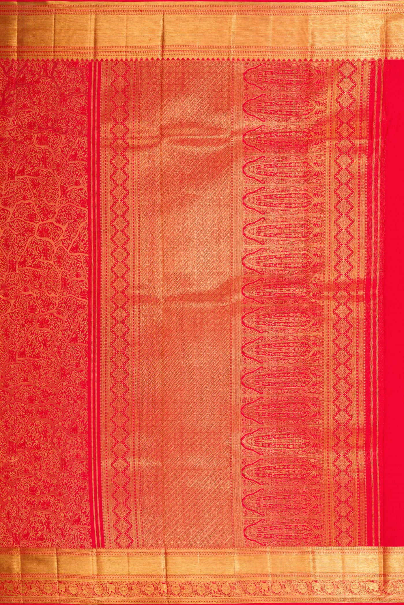 Close up image of the pallu of Red Dual Tone Kanjivaram Silk Saree with Zari Brocade on the body and Zari Border. 