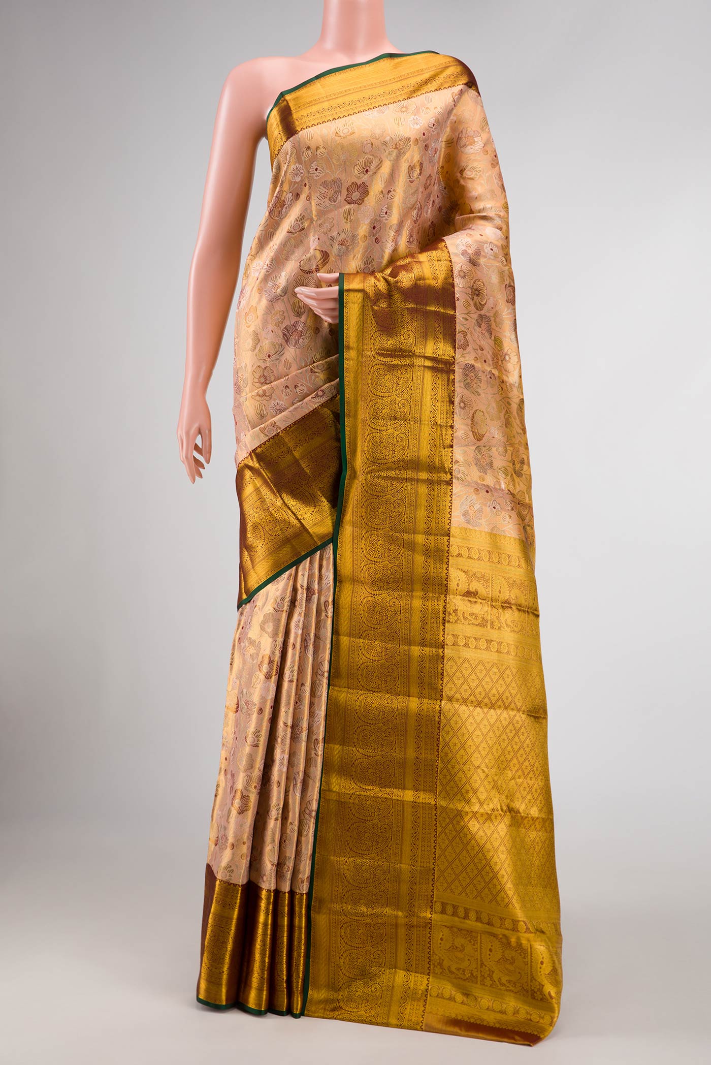 Peach Dual Tone Kanchipuram Tissue Silk Saree with Zari Brocade on the body and Zari Border.  displayed on a mannequin