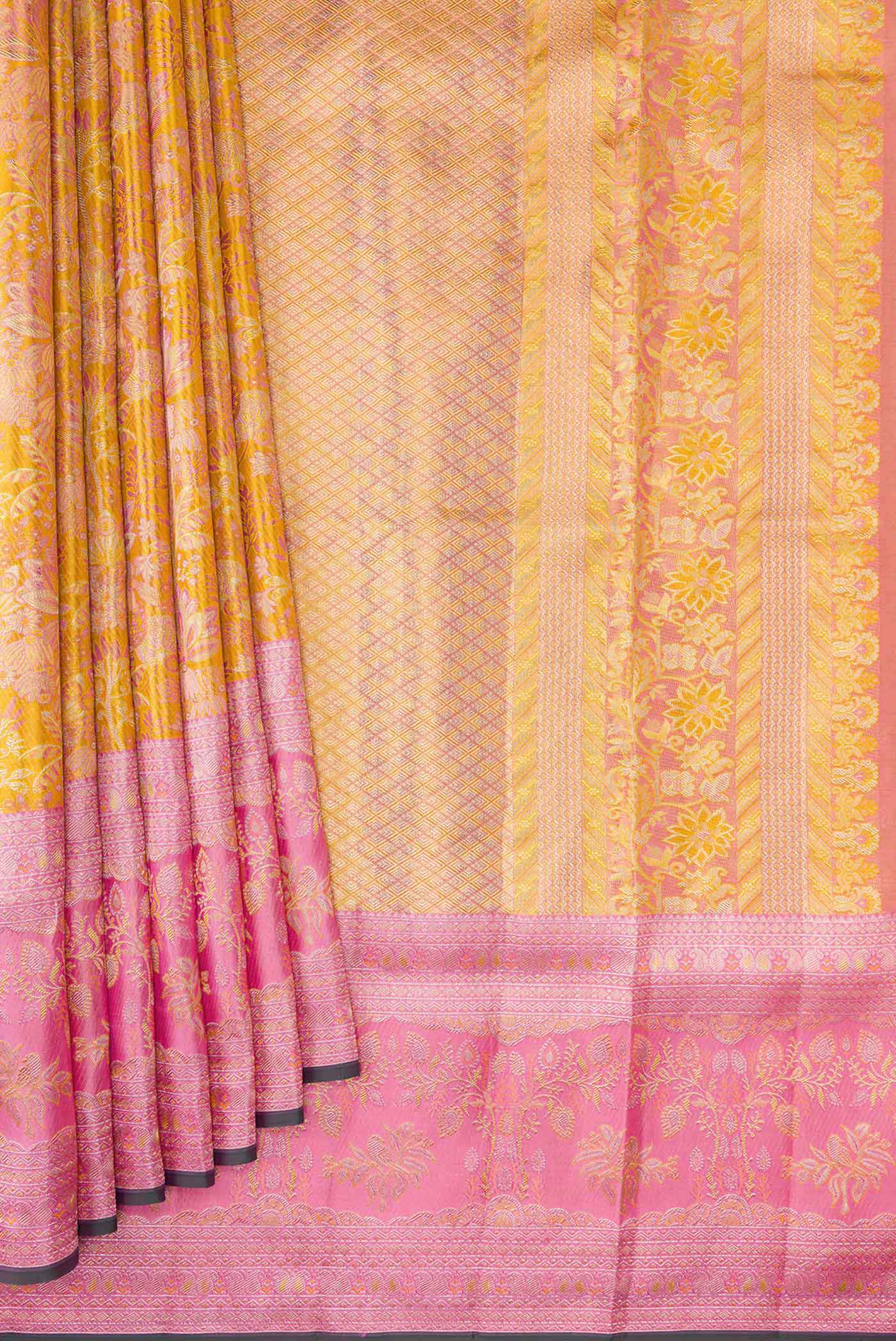 Pleats and pallu of Gold Dual Tone Kanjivaram Tissue Silk Saree with Zari Brocade on the body and Zari Border. 