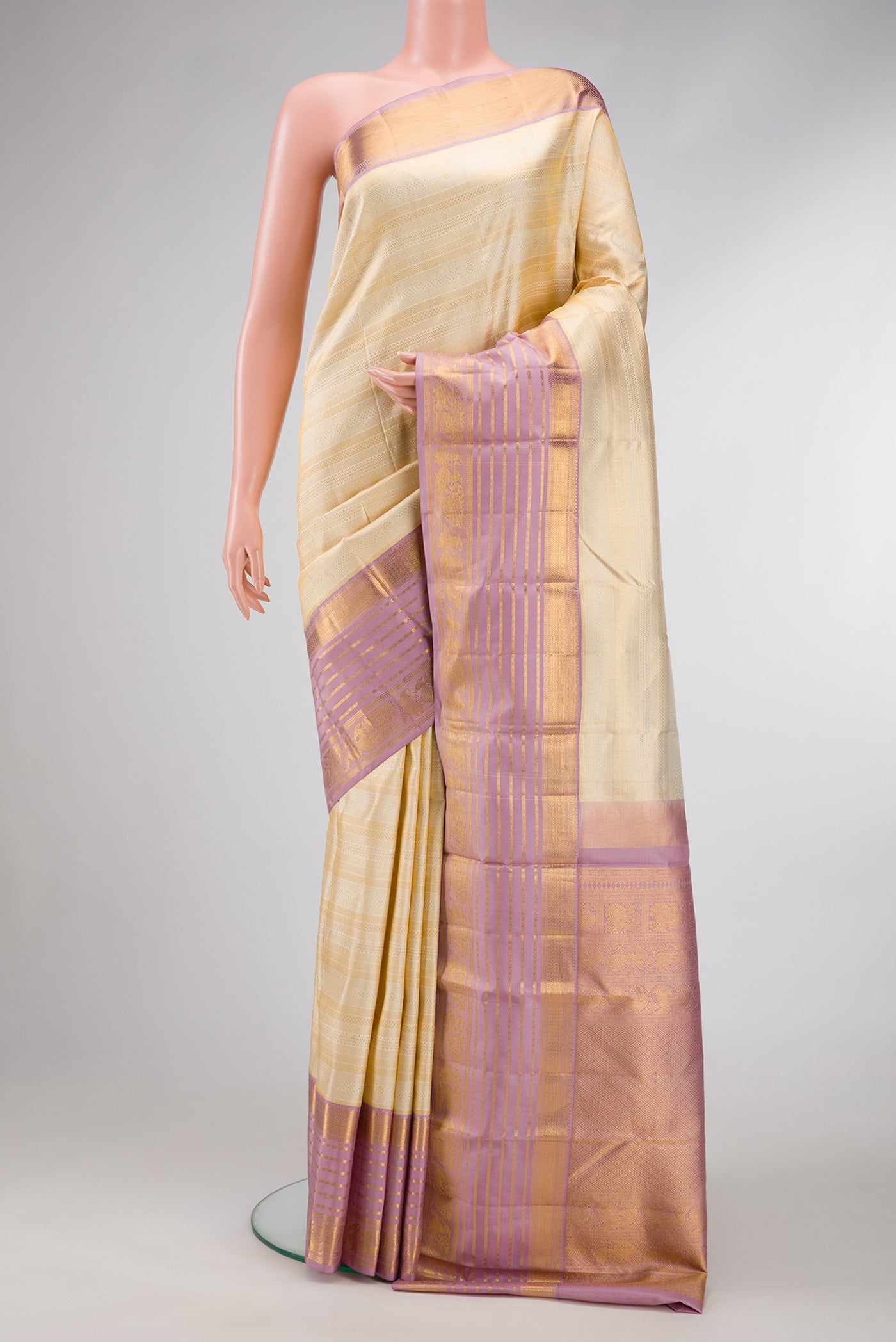 Off White Dual Tone Kanjivaram Silk Saree with Zari Brocade on the body and Zari Border.  displayed on a mannequin