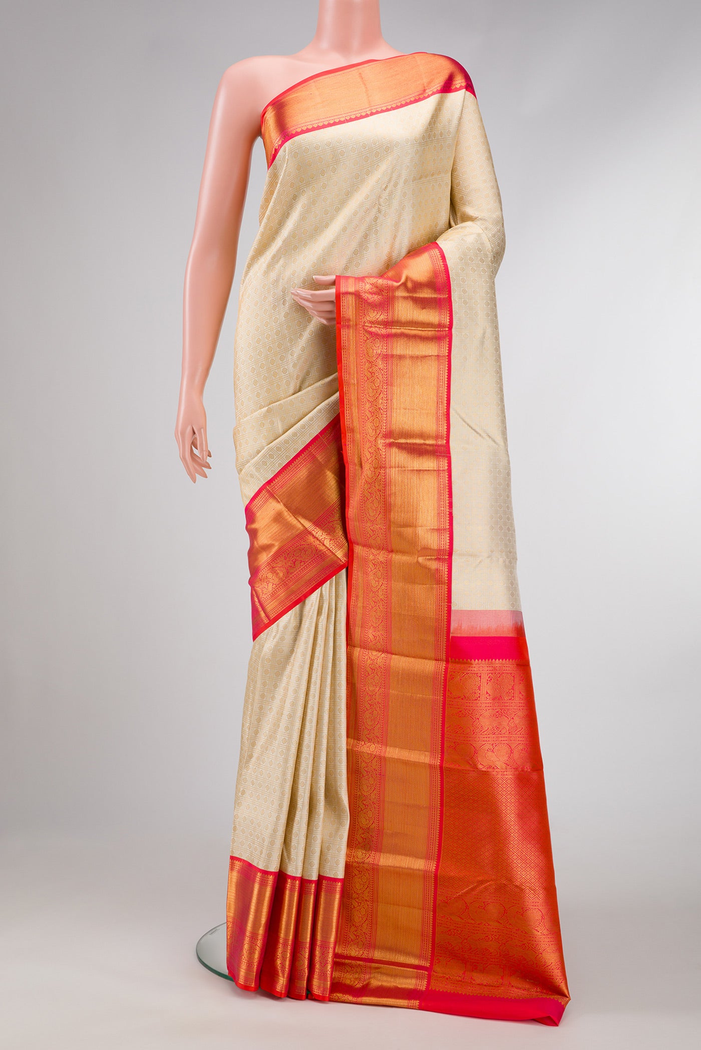 Off White Dual Tone Kanjivaram Silk Saree with Zari Brocade on the body and Zari Border.  displayed on a mannequin