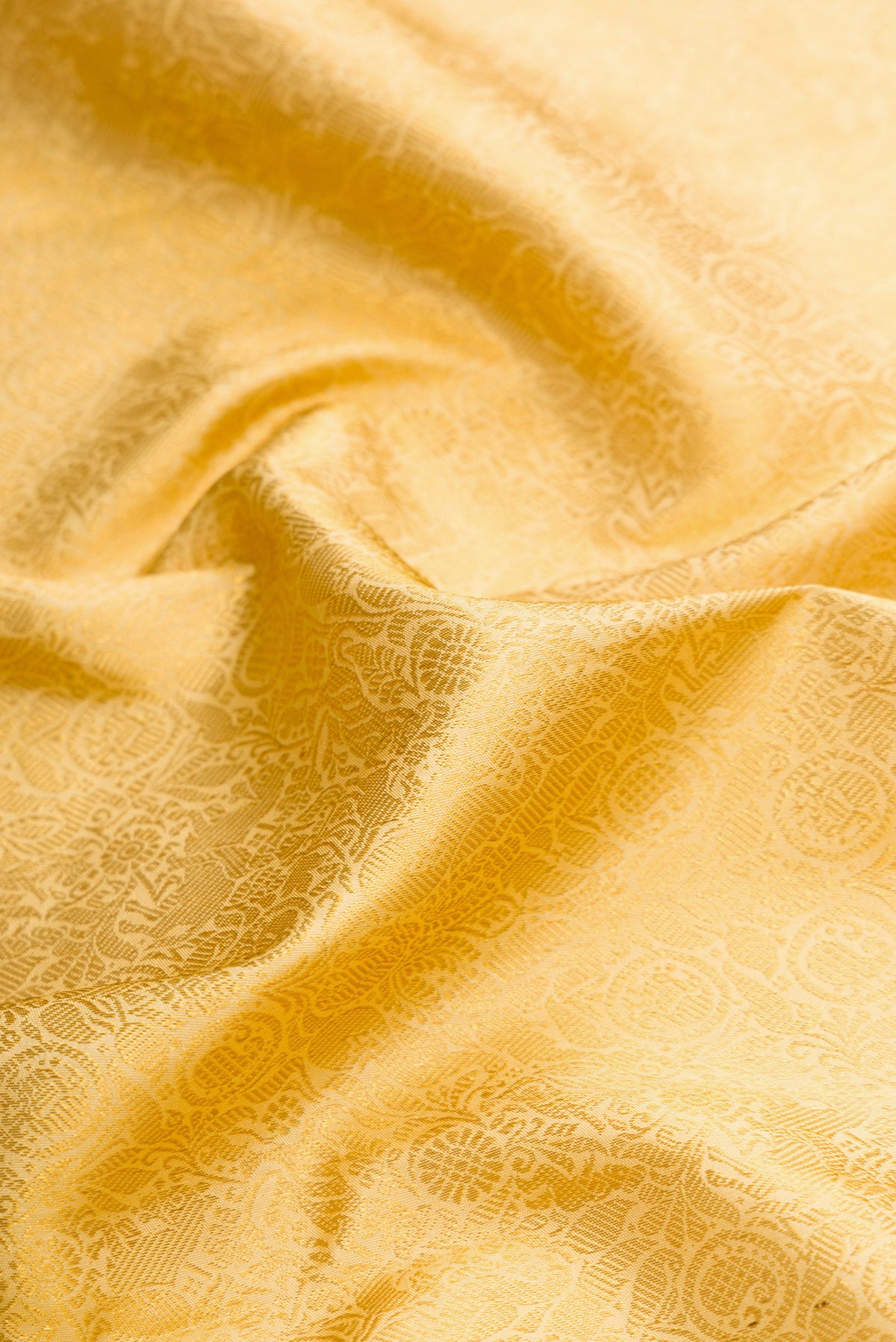 Close up of Sandal Dual Tone Kanjivaram Silk Saree with Zari Brocade on the body and Zari Border.  displaying folds