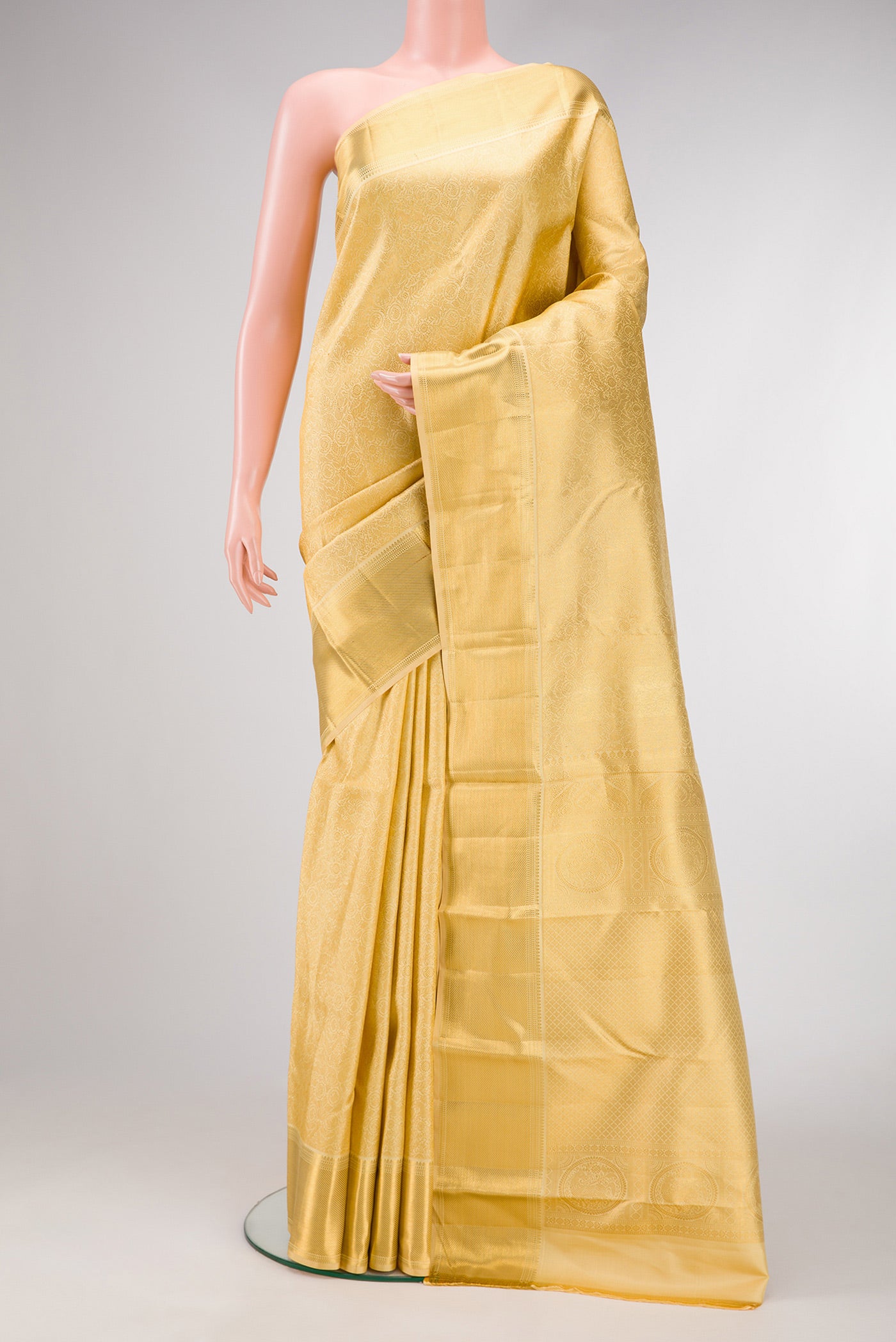 Sandal Dual Tone Kanjivaram Silk Saree with Zari Brocade on the body and Zari Border.  displayed on a mannequin