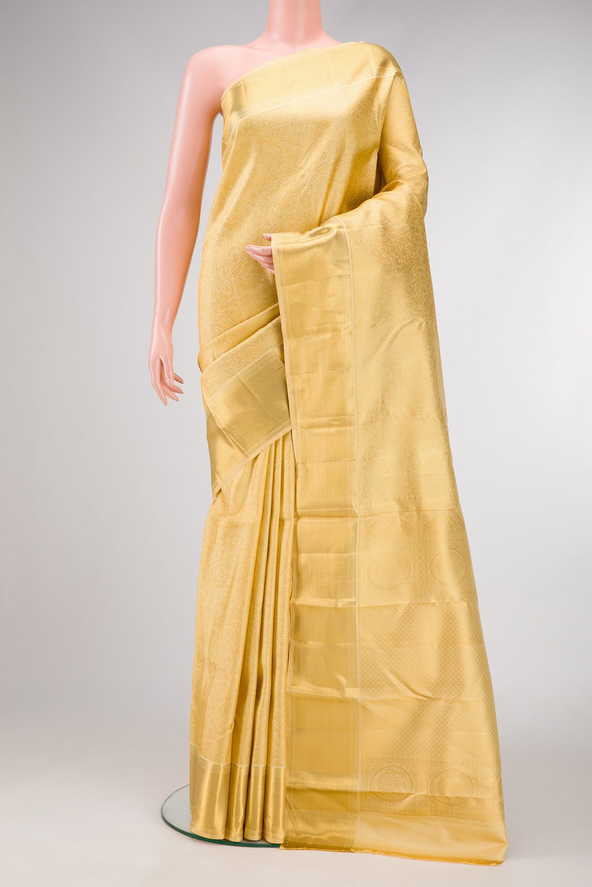 Sandal Dual Tone Kanjivaram Silk Saree with Zari Brocade on the body and Zari Border.  displayed on a mannequin