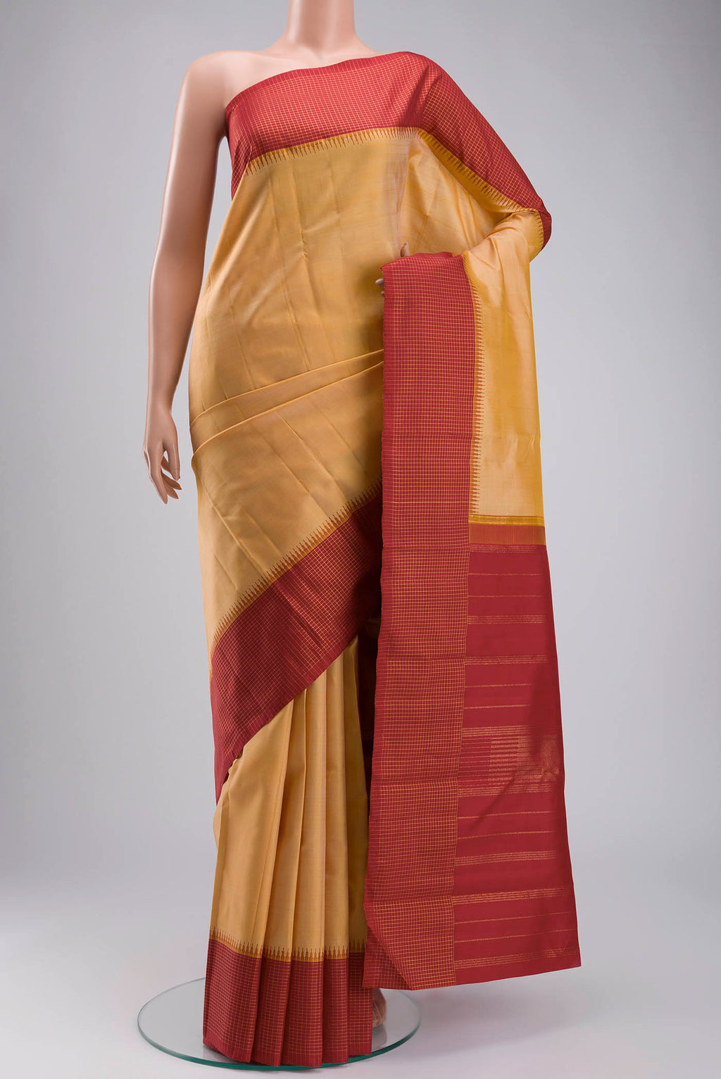 Sandal Kanchipuram Silk Saree with Plain Body and Checks Border displayed on a mannequin