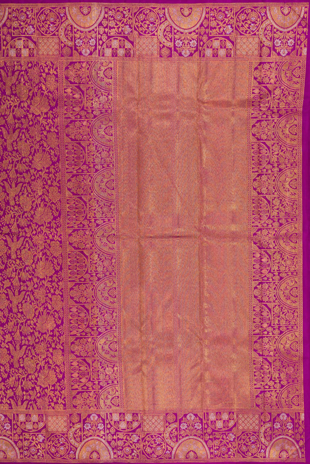 Close up image of the pallu of Magenta Kanjivaram Silk Saree with Zari Brocade on the body and Fancy Border. 