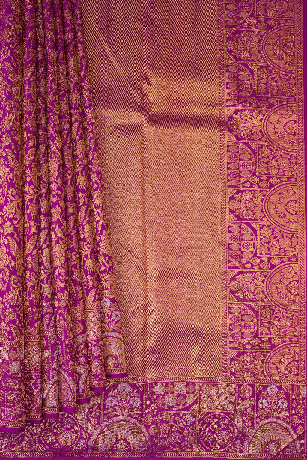 Pleats and pallu of Magenta Kanjivaram Silk Saree with Zari Brocade on the body and Fancy Border. 