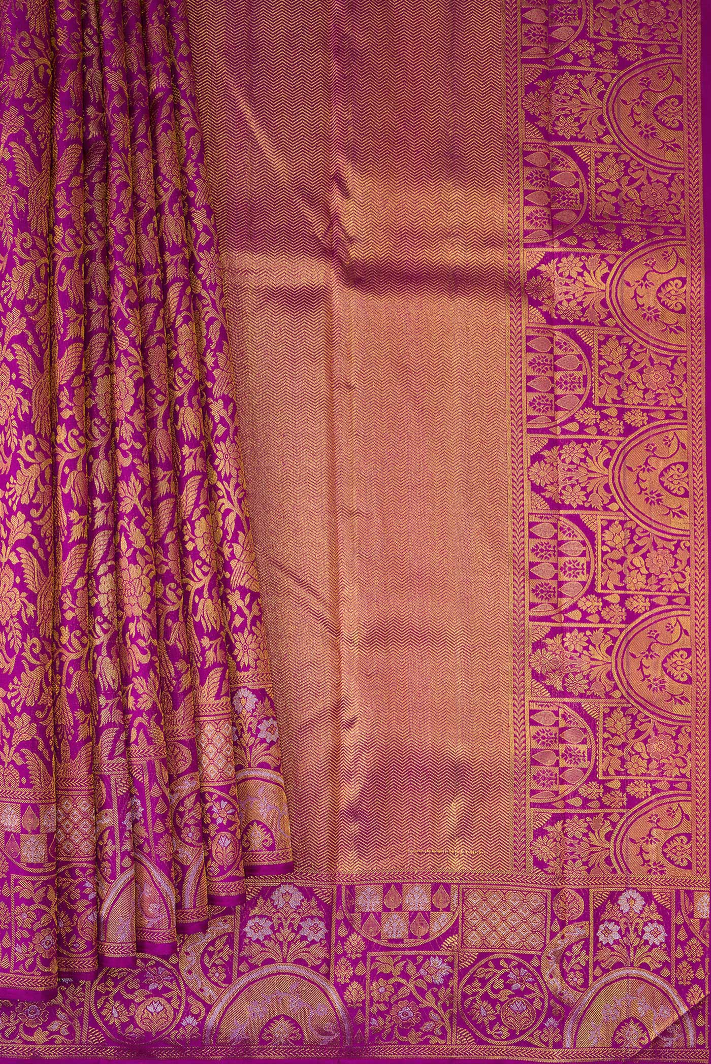 Pleats and pallu of Magenta Kanjivaram Silk Saree with Zari Brocade on the body and Fancy Border. 