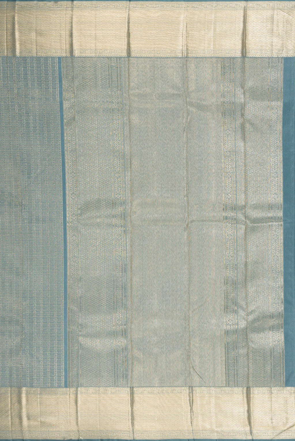 Close up image of the pallu of Grey Dual Tone Kanchipuram Silk Saree with Zari Brocade on the body and Zari Border. 