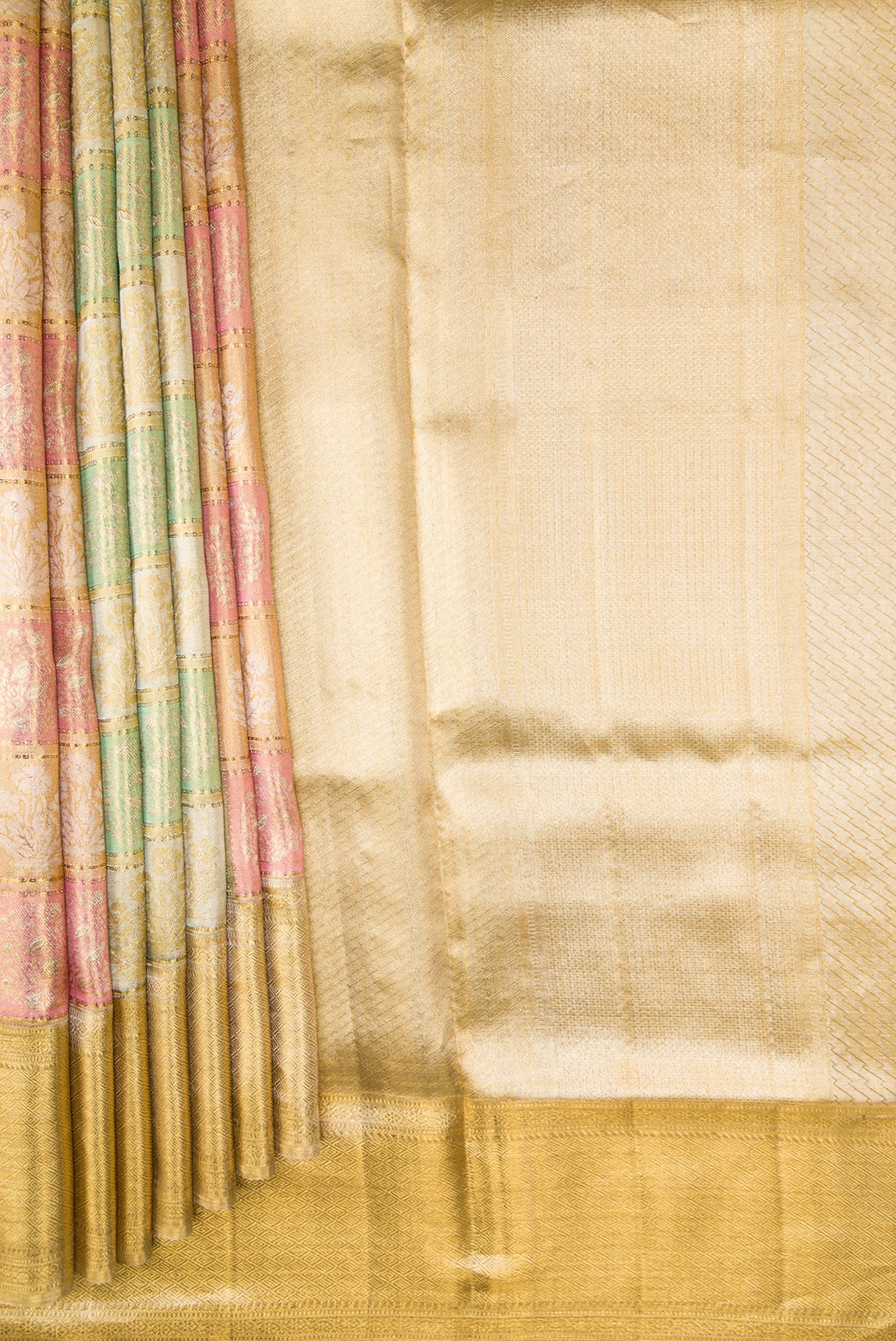 Pleats and pallu of Gold, Pink and Green Color Kanjivaram Tissue Silk Saree with Zari Brocade on the body and Zari Border. 