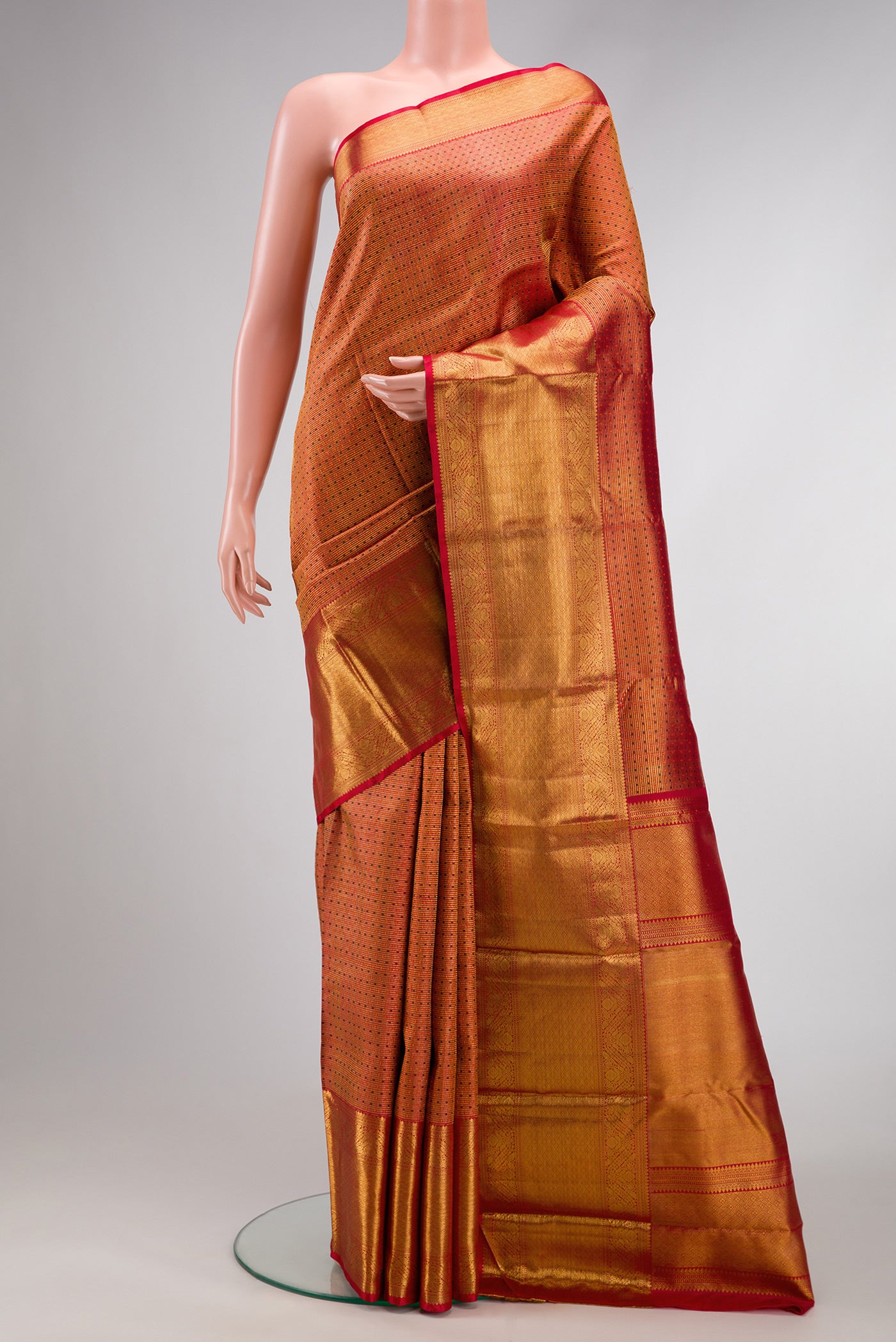 Red Dual Tone Kanchipuram Silk Saree with Zari Brocade on the body and Zari Border.  displayed on a mannequin