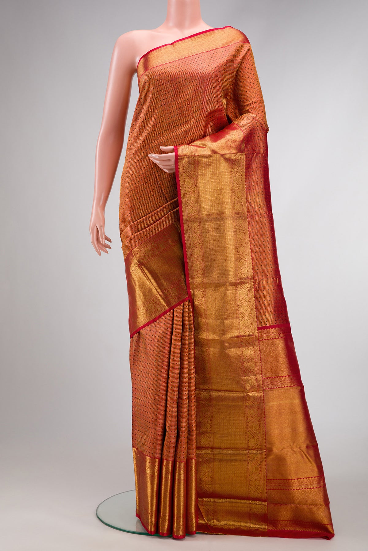Red Dual Tone Kanchipuram Silk Saree with Zari Brocade on the body and Zari Border.  displayed on a mannequin