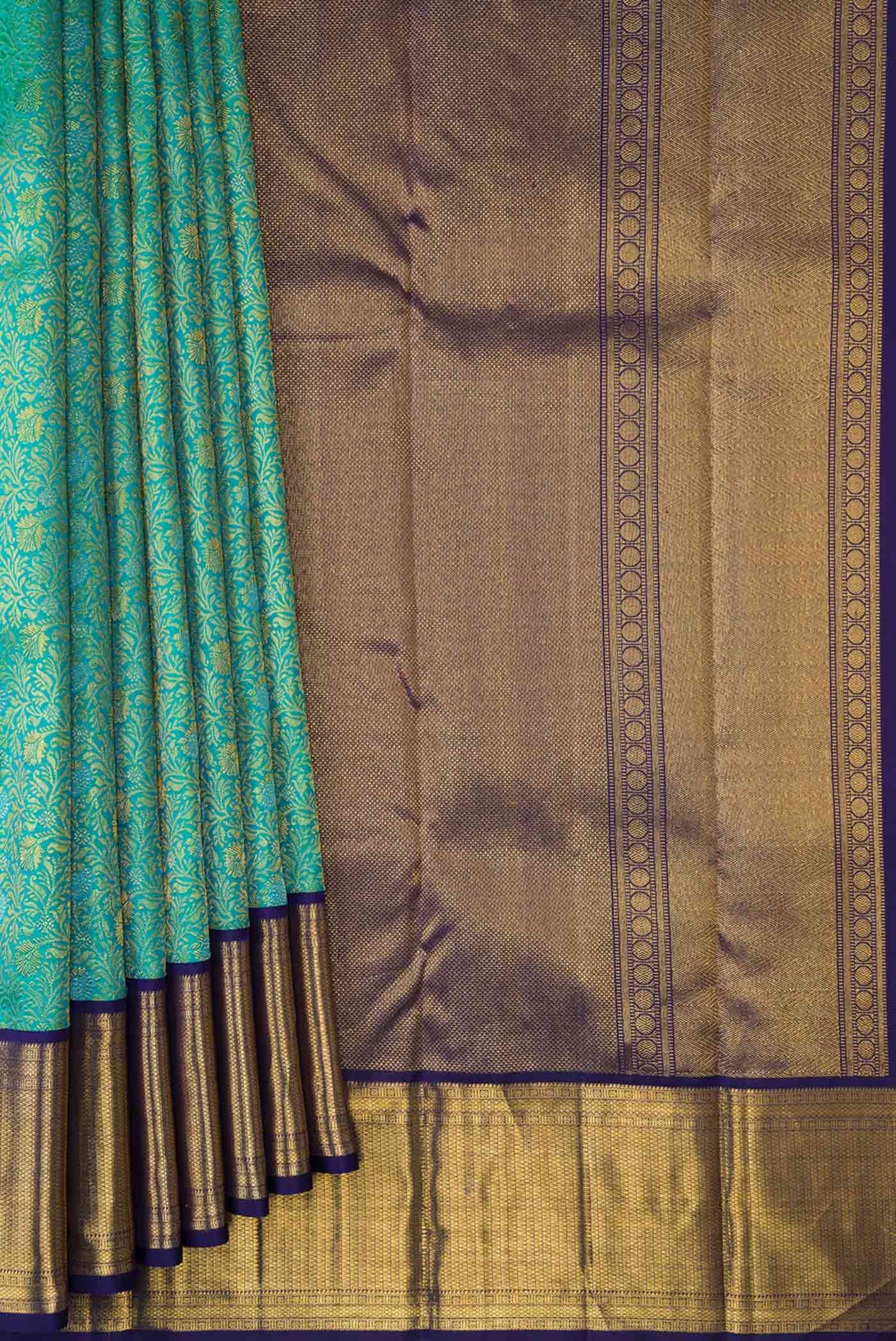 Pleats and pallu of Sea Green Dual Tone Kanchipuram Silk Saree with Zari Brocade on the body and Zari Border. 