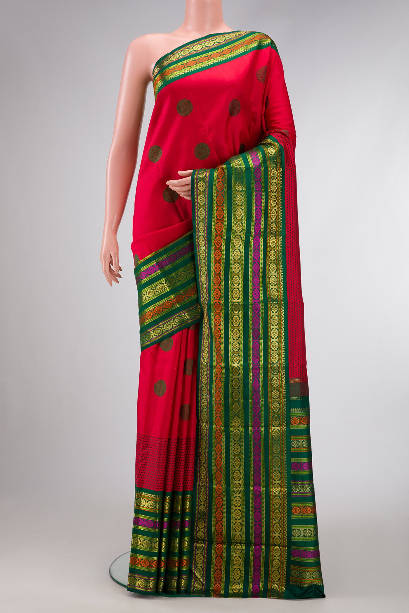 Pure Silk Pure Zari Red Dual Tone Kanchipuram Saree with Thread Butta on the body and Zari And Thread Border.  displayed on a mannequin