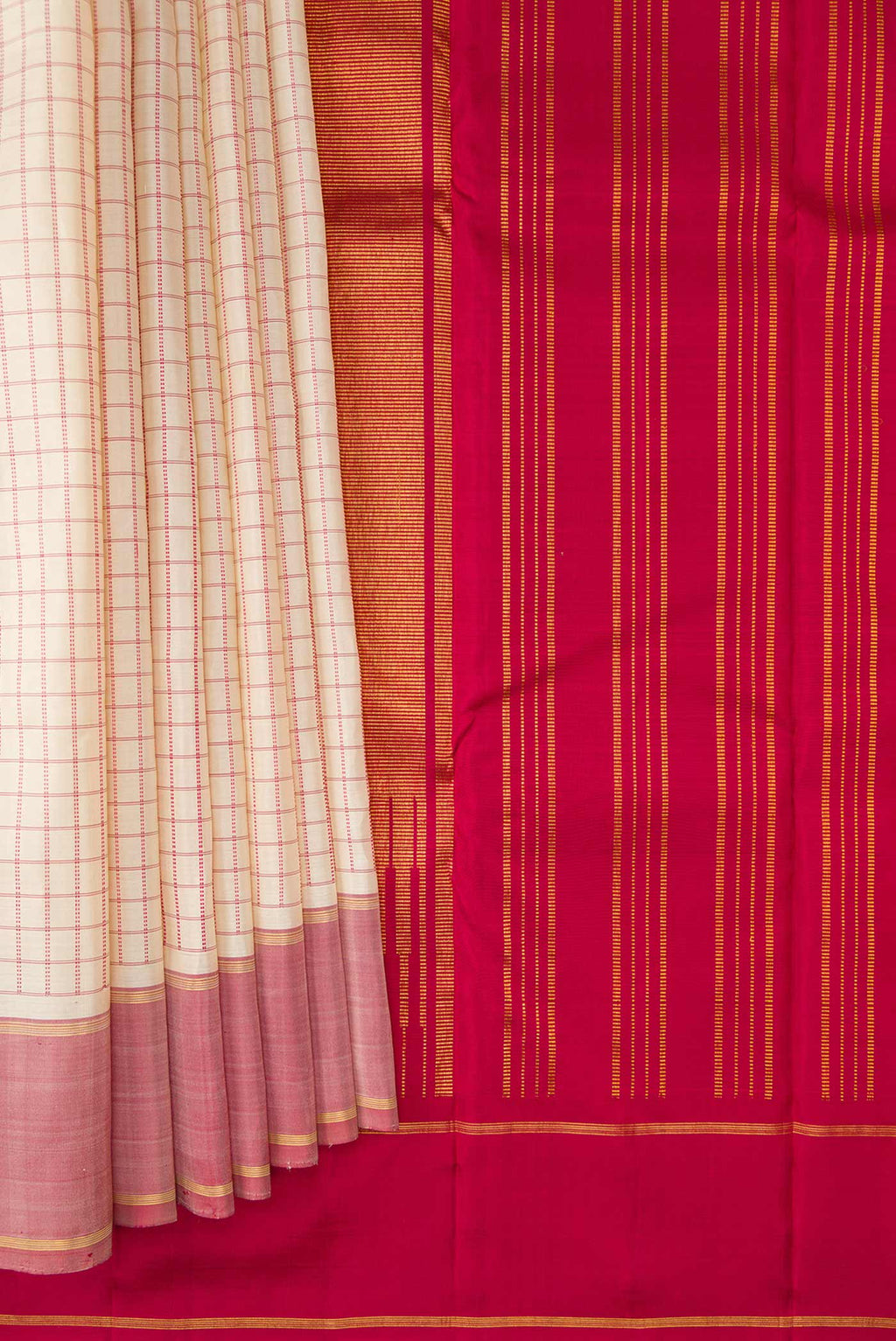Pleats and pallu of Off White Dual Tone Kanchipuram Silk Saree with Checked design on the body and Zari Border. 