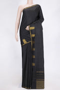 Black Dual Tone Kanchipuram Saree with Plain Body and Fancy Border.  displayed on a mannequin
