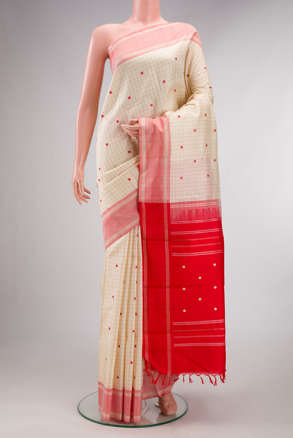 Pure Silk Sandal Kanjivaram Saree with Checked design on the body and Thread Border.  displayed on a mannequin