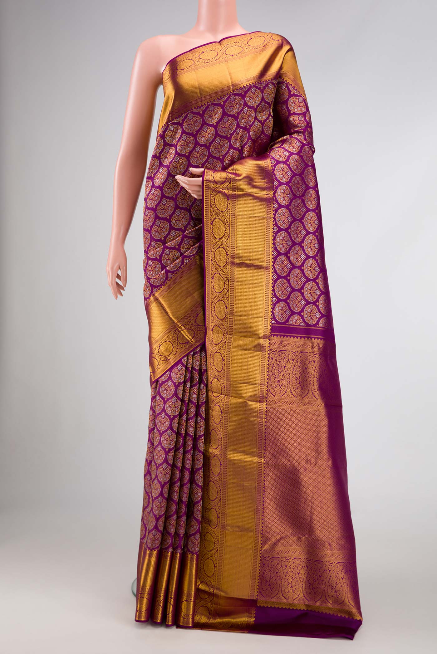 Purple Dual Tone Kanchipuram Silk Saree with Zari Brocade on the body and Zari Border.  displayed on a mannequin