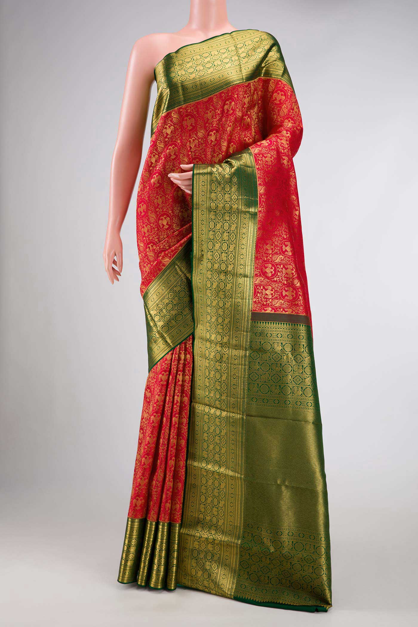 Red Dual Tone Kanchipuram Silk Saree with Zari Brocade on the body and Zari Border.  displayed on a mannequin