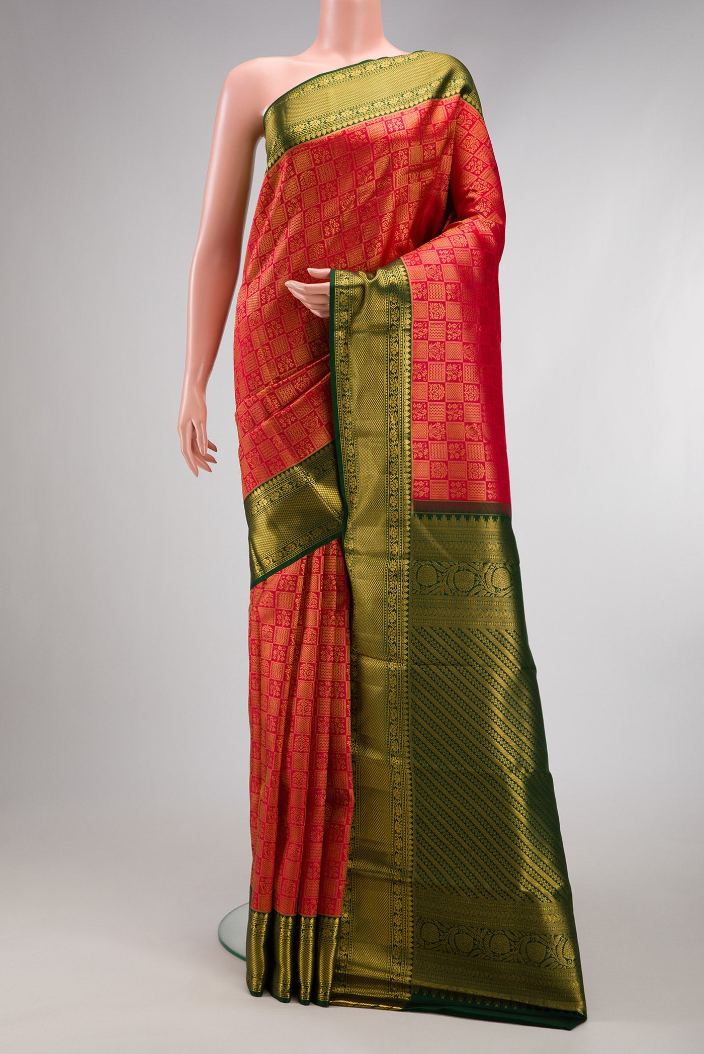 Red Kanchipuram Silk Saree with Zari Brocade on the body and Zari Border.  displayed on a mannequin