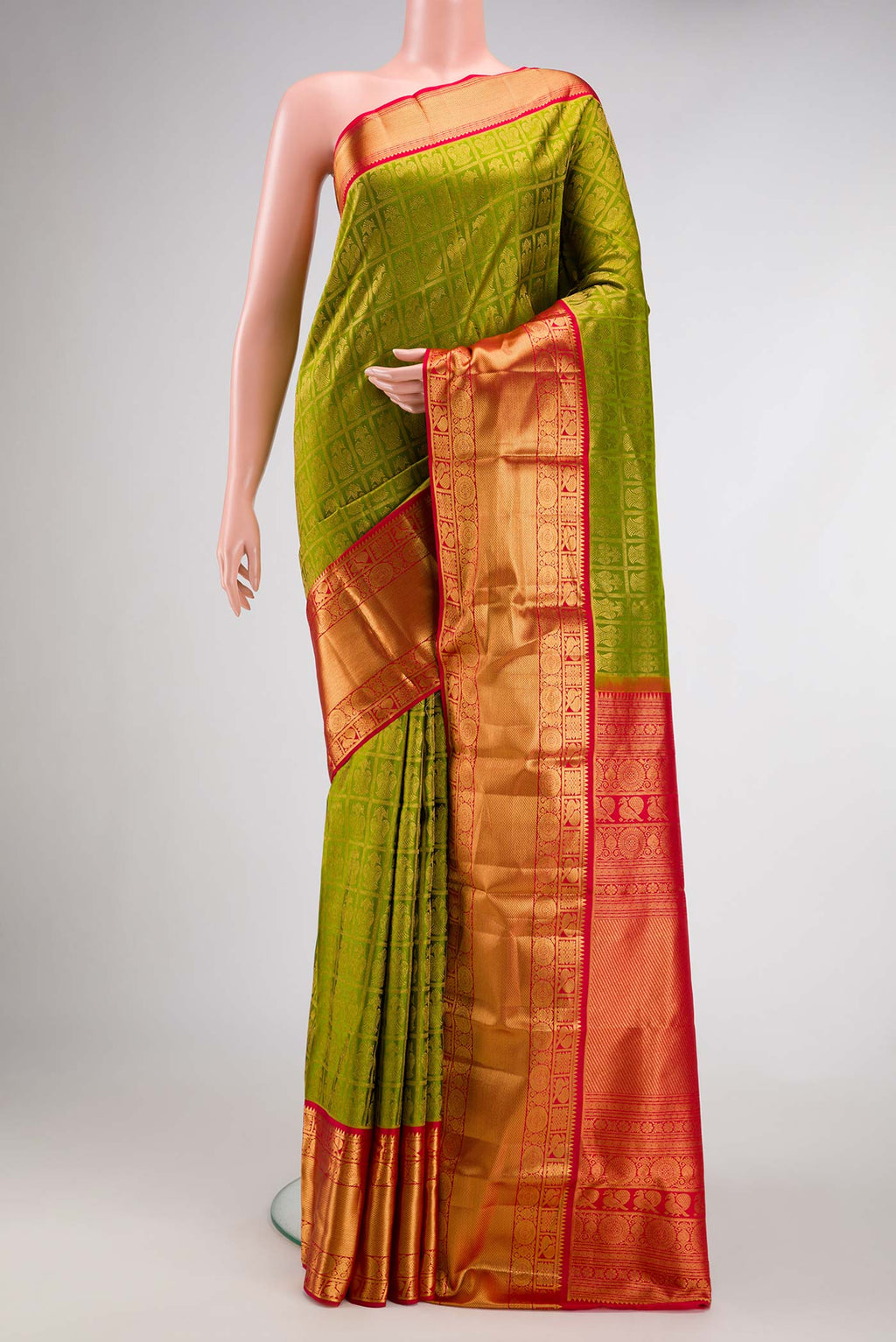 Mehandi Green Dual Tone Kanchipuram Silk Saree with Zari Brocade on the body and Zari Border.  displayed on a mannequin
