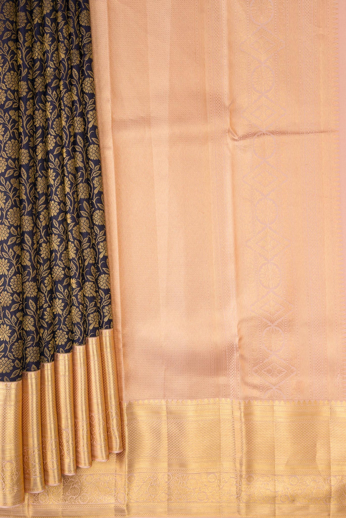 Pleats and pallu of Navy Blue Dual Tone Kanchipuram Silk Saree with Zari Brocade on the body and Zari Border. 