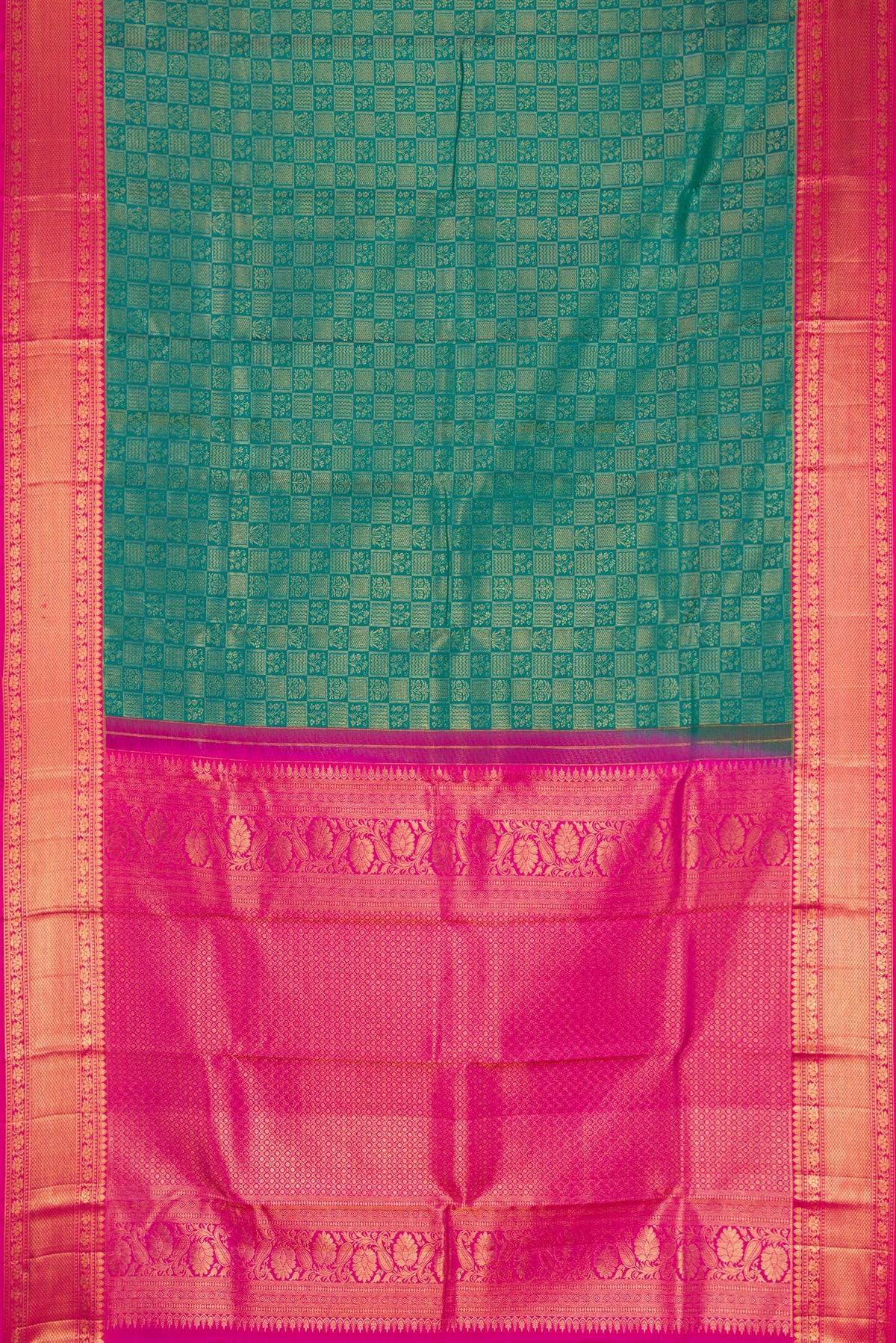 Flat view of Green Kanchipuram Silk Saree with Zari Brocade on the body and Zari Border. 