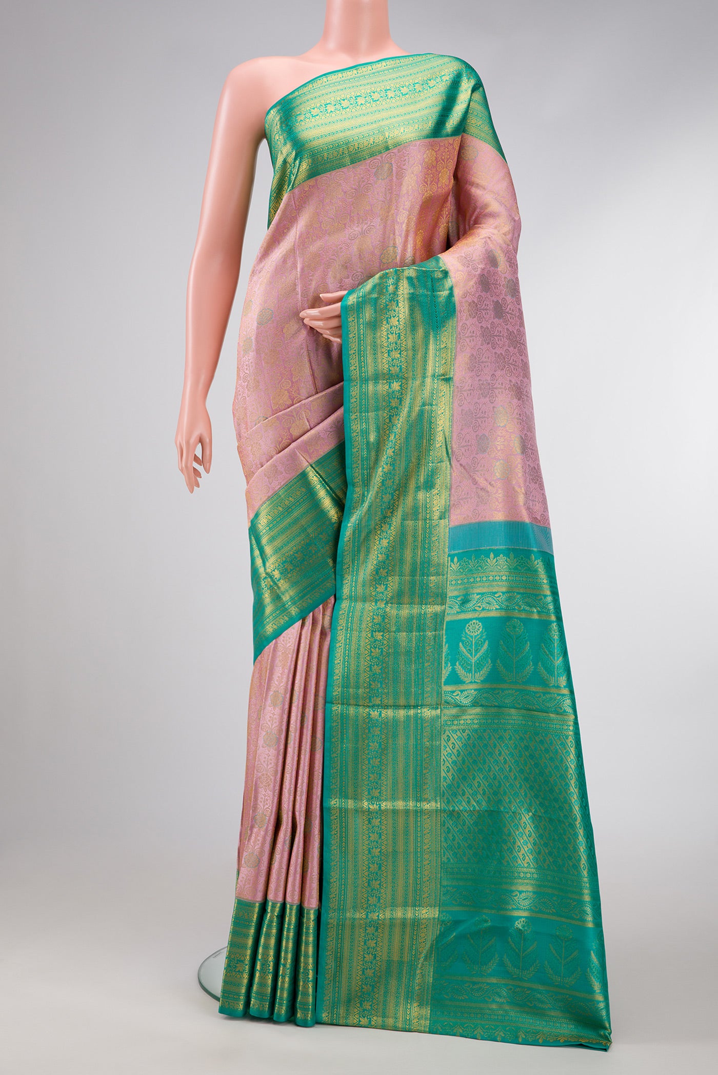Rose Gold Dual Tone Kanchipuram Silk Saree with Zari Brocade on the body and Zari Border.  displayed on a mannequin