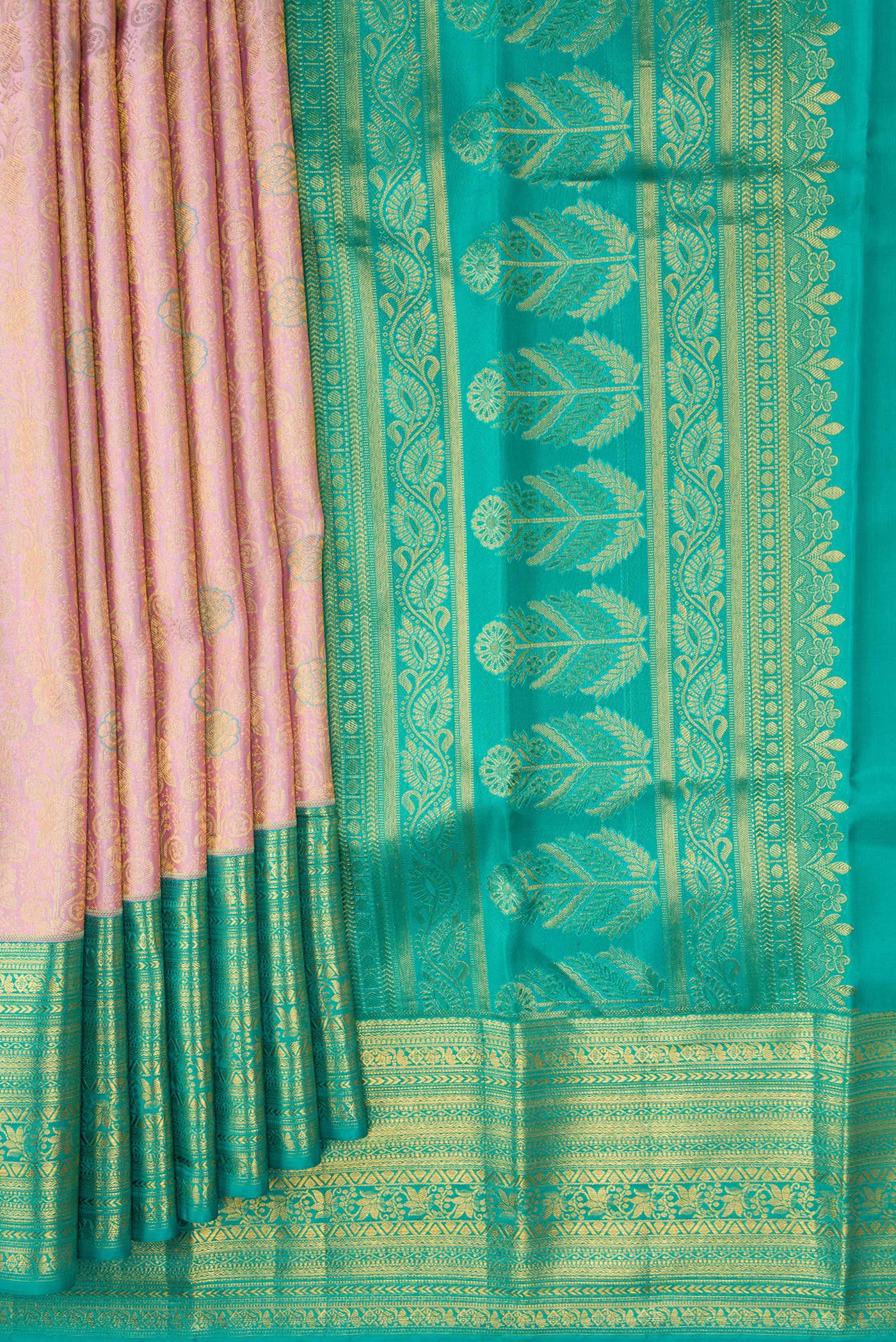 Pleats and pallu of Rose Gold Dual Tone Kanchipuram Silk Saree with Zari Brocade on the body and Zari Border. 