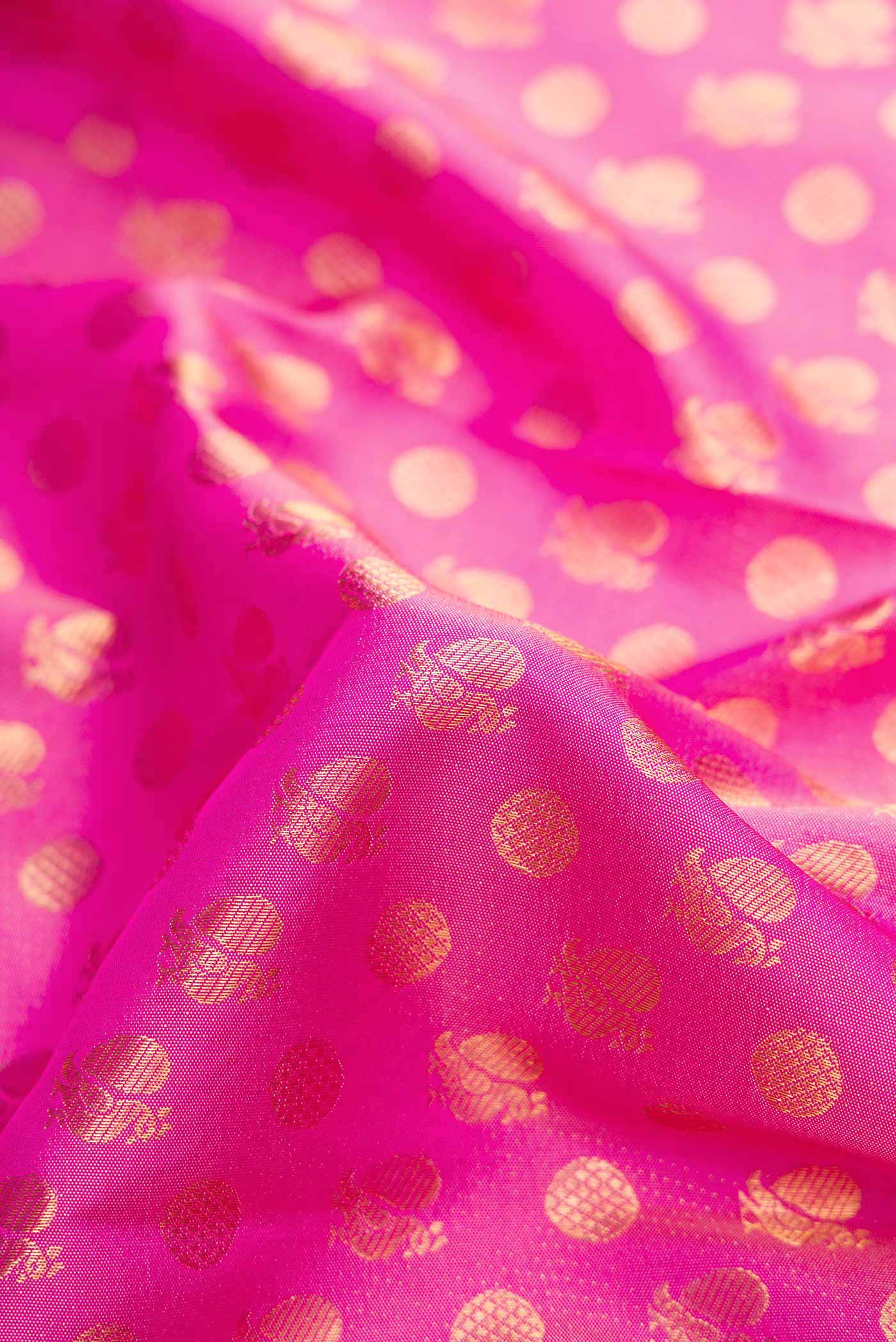 Close up of Pink Dual Tone Kanjivaram Silk Saree with Zari Brocade on the body and Fancy Border.  displaying folds