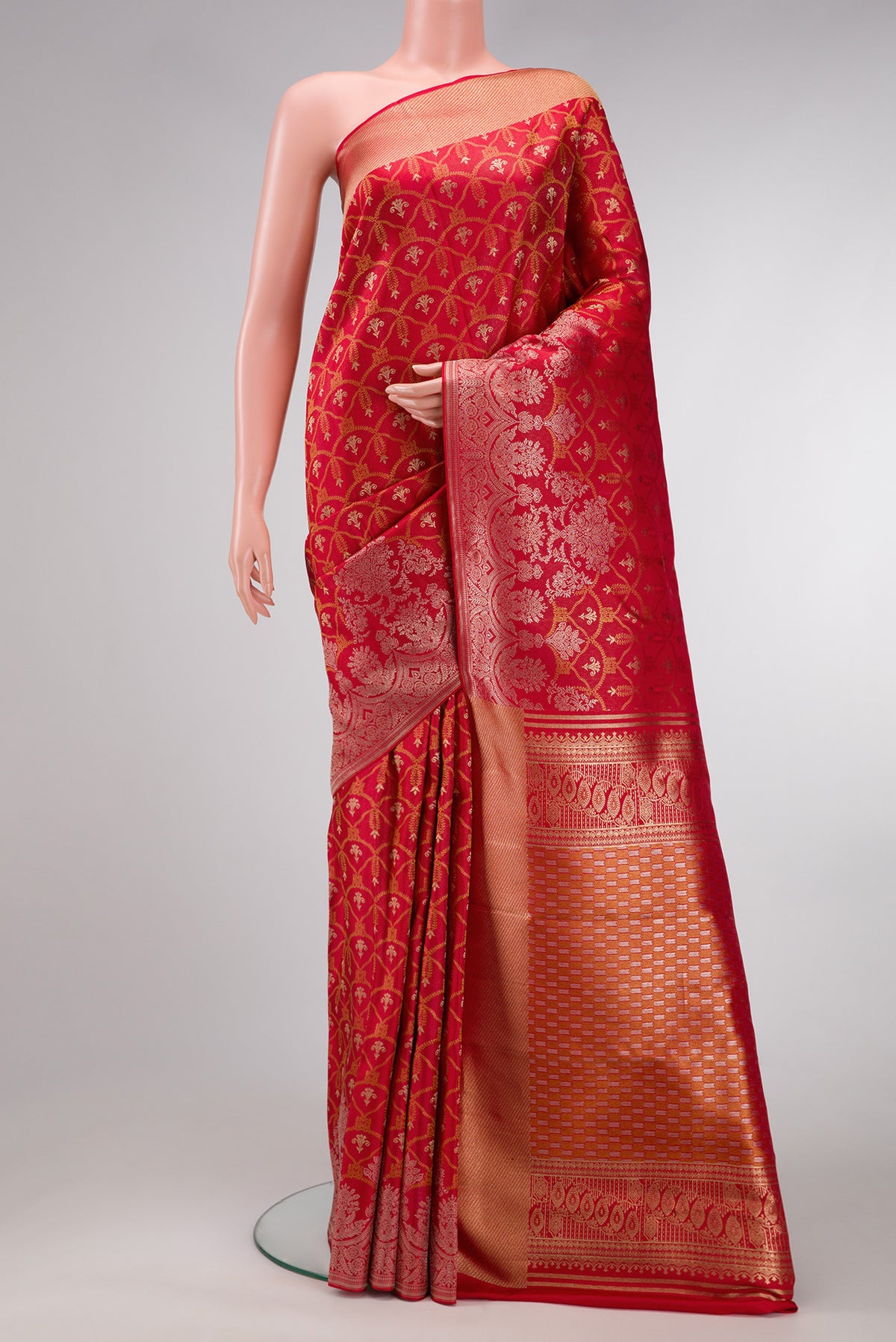 Red Dual Tone Kanjivaram Silk Saree with Zari Brocade on the body and Fancy Border.  displayed on a mannequin