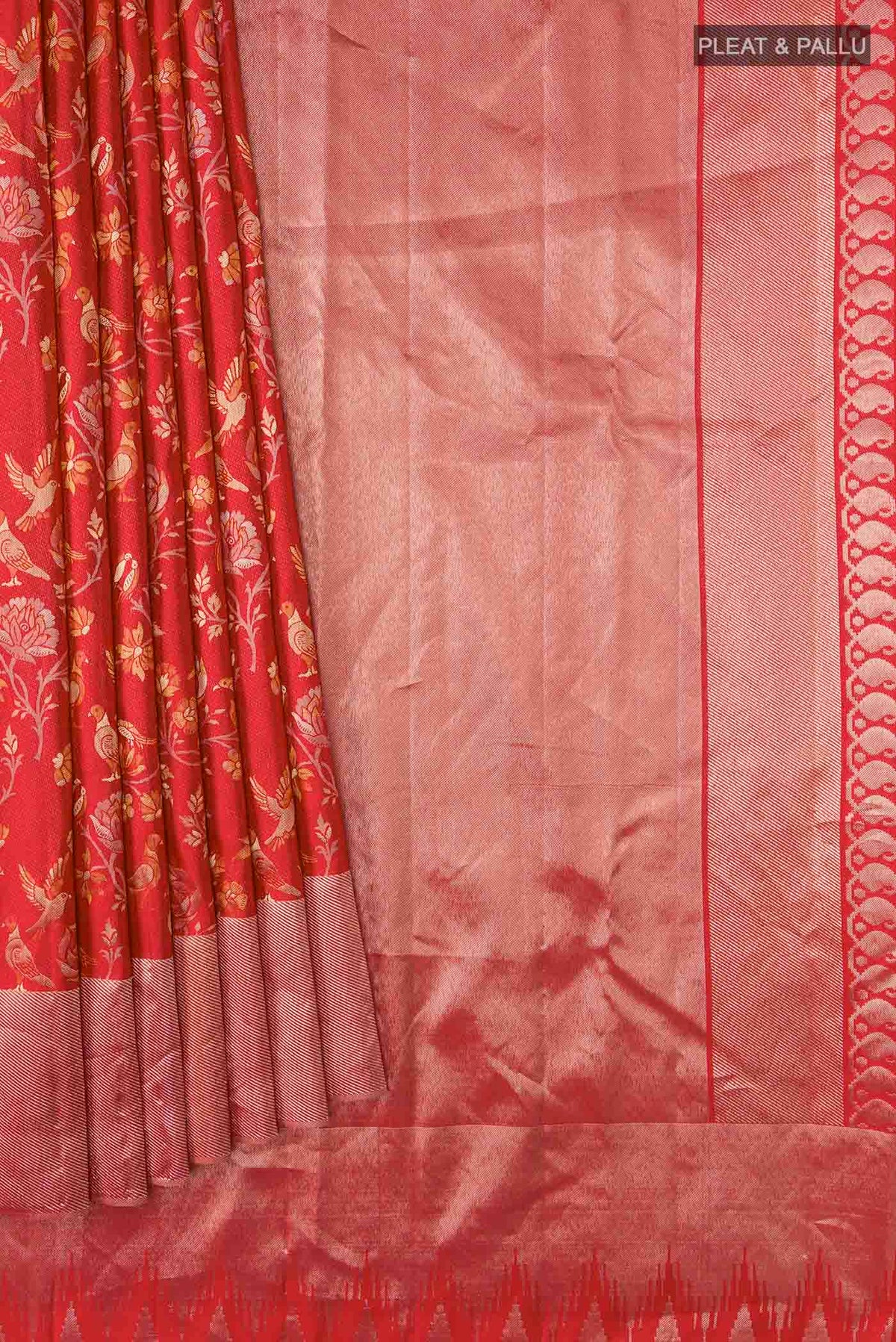 Pleats and pallu of Red Kanchipuram Silk Saree with Zari Butta on the body and Zari Border