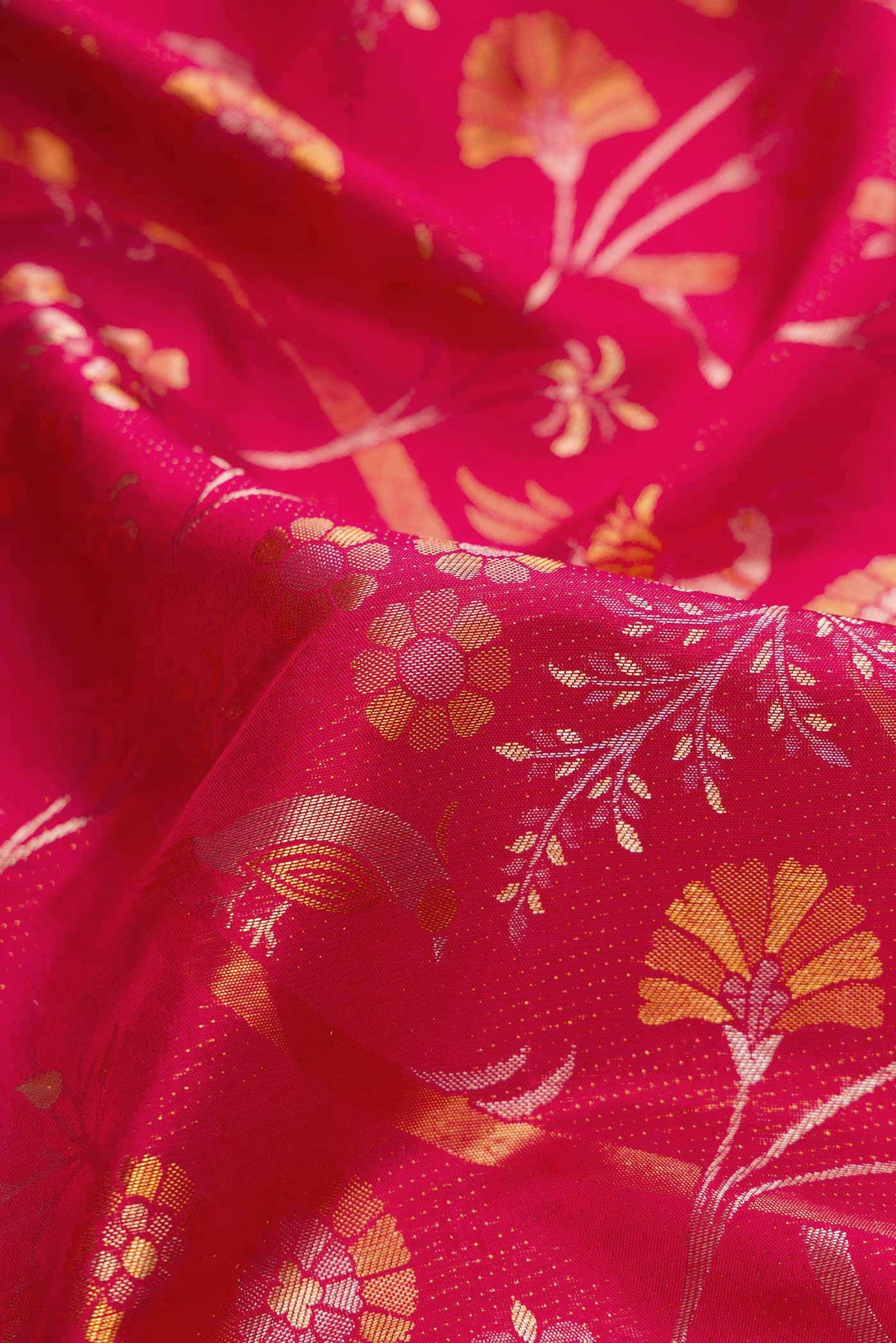 Close up of Red Dual Tone Kanjivaram Silk Saree with Zari Brocade on the body and Zari Border.  displaying folds