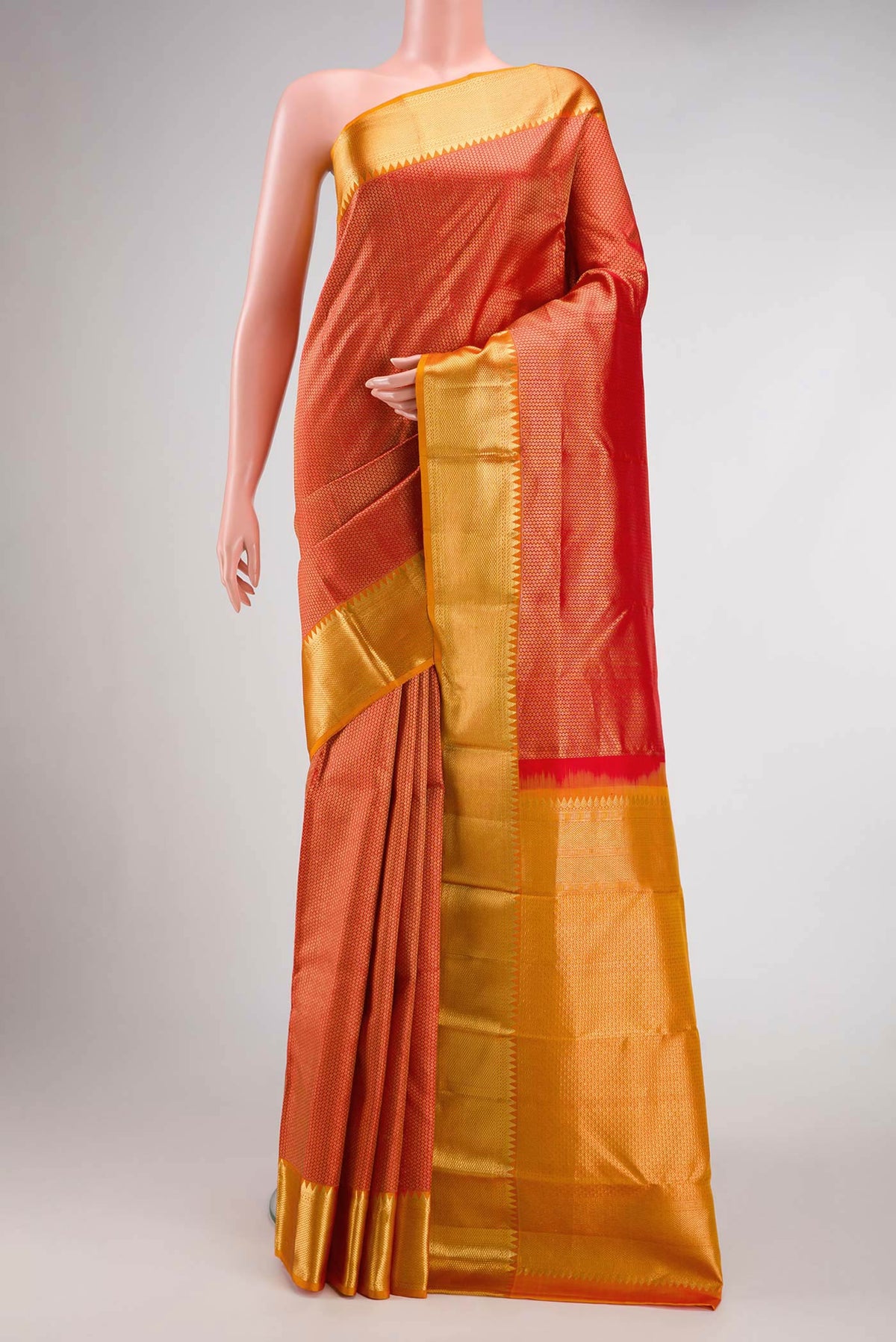 Red Dual Tone Kanjivaram Silk Saree with Zari Brocade on the body and Zari Border.  displayed on a mannequin