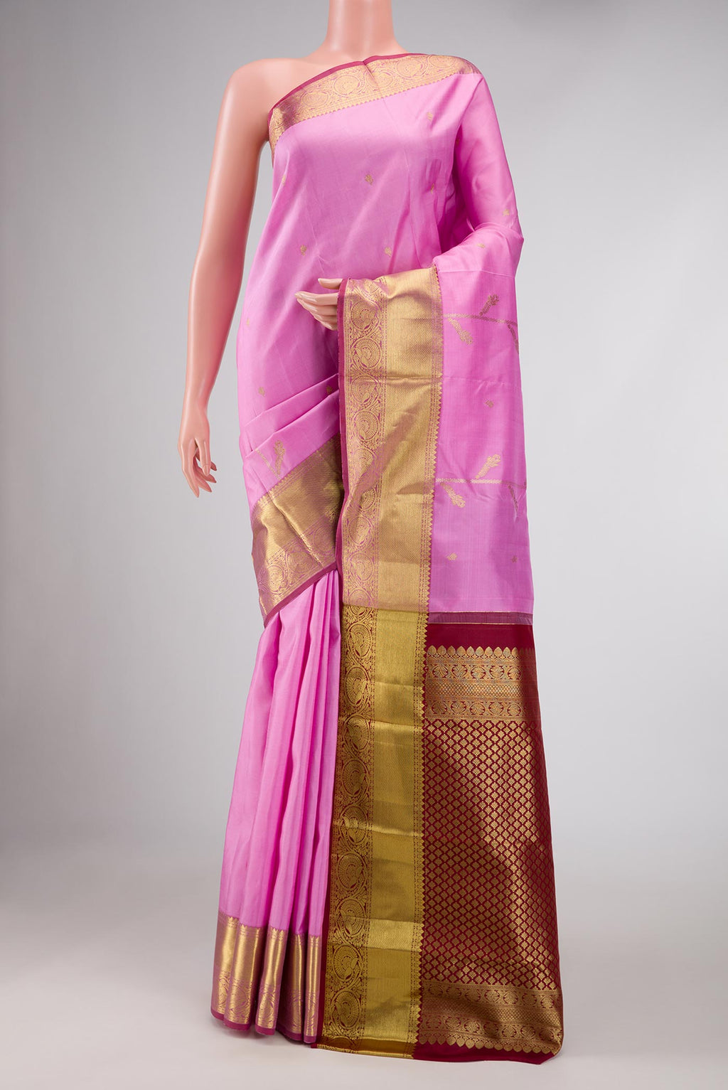Pink Dual Tone Kanchipuram Saree with Zari Butta on the body and Zari Border displayed on a mannequin