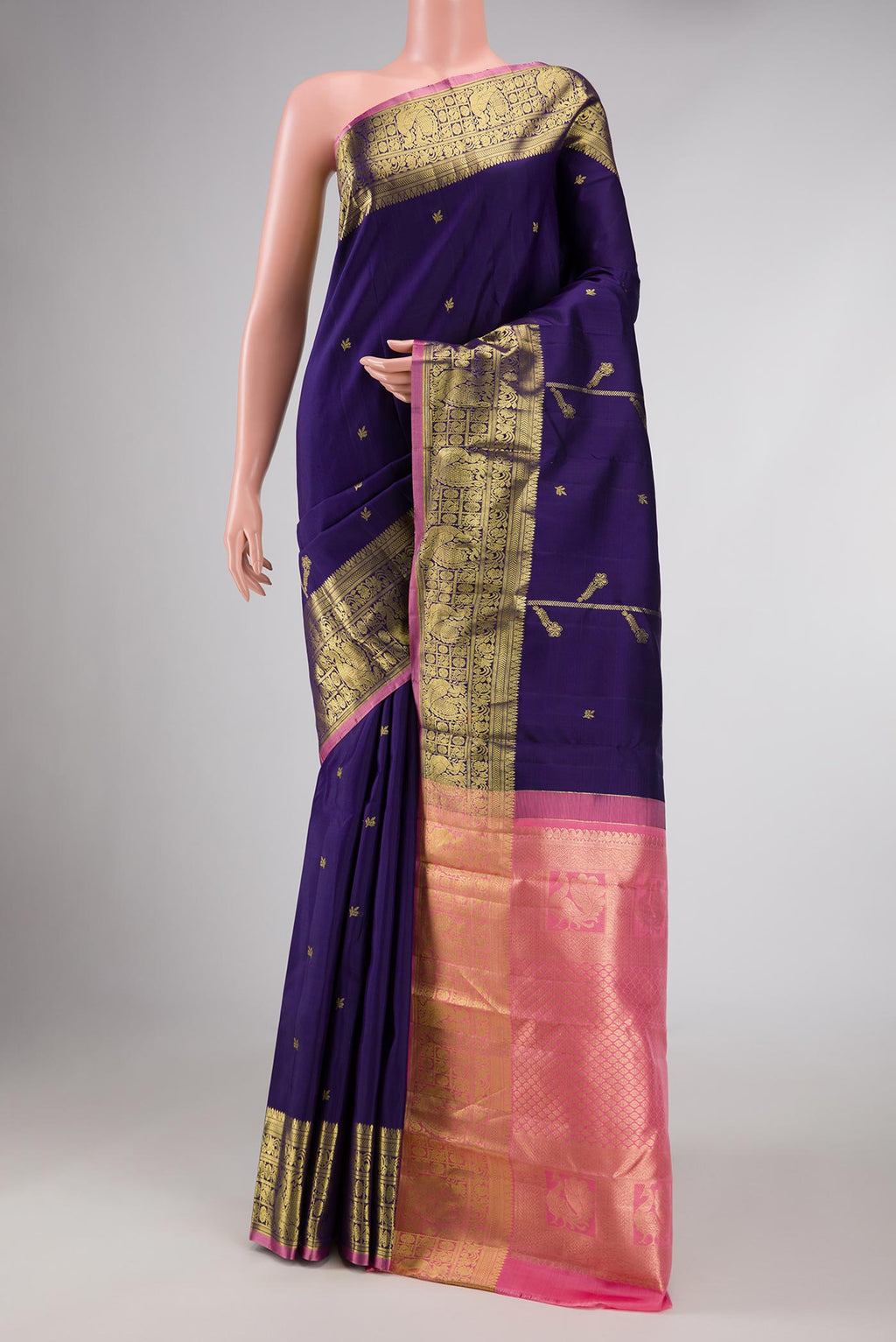 Navy Blue Dual Tone Kanchipuram Saree with Zari Butta on the body and Zari Border displayed on a mannequin