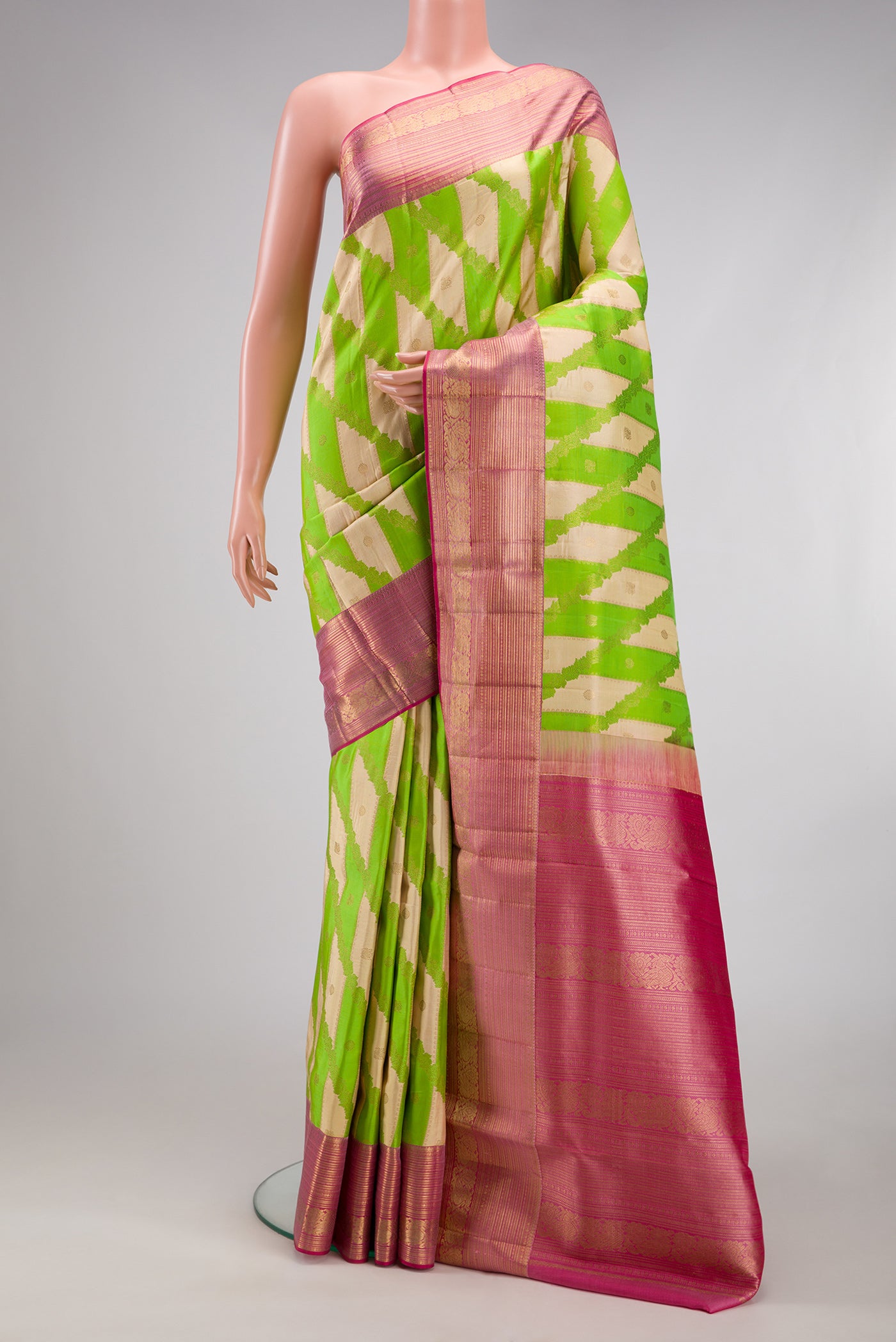 Parrot Green Dual Tone Kanjivaram Silk Saree with Zari Brocade on the body and Zari Border.  displayed on a mannequin