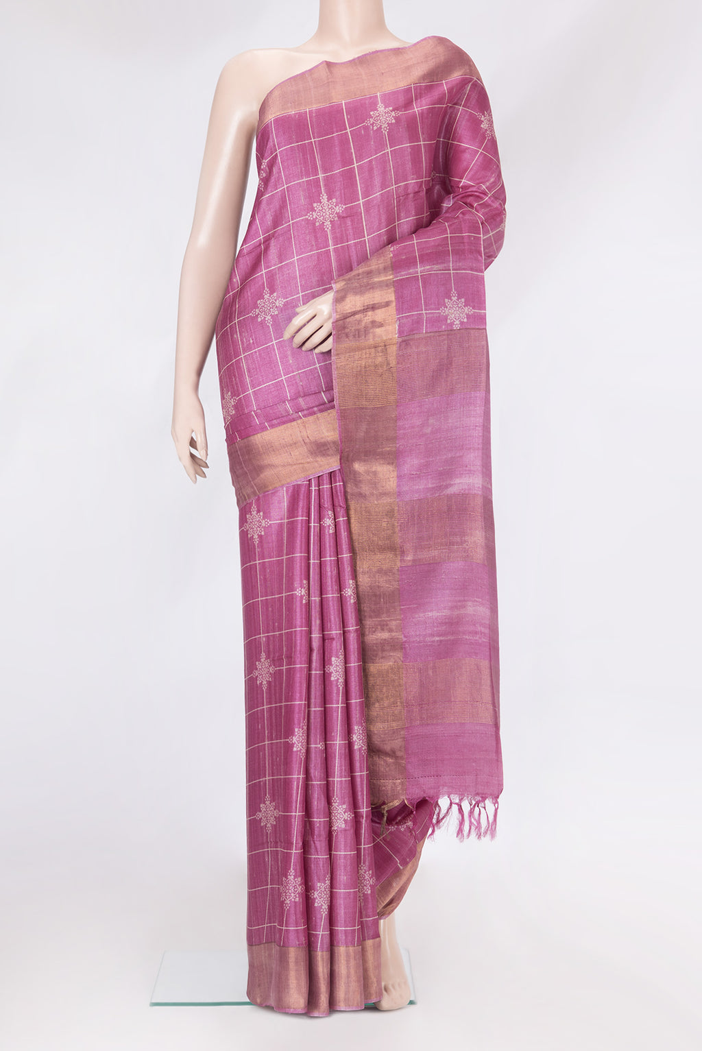 Pink Tussar Silk Saree with Checked design on the body and Zari Border.  displayed on a mannequin